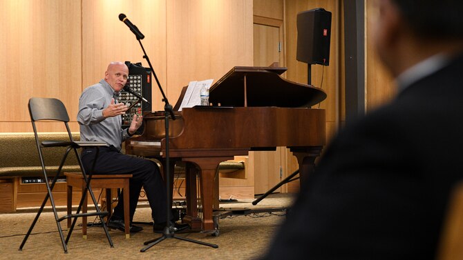 Joel McCausland prepares to perform in the base chapel during a National Prayer Luncheon at Hill Air Force Base, Utah, Feb. 25, 2020. The annual event offers the opportunity for people of various faiths to come together and observe the tradition of faith and prayer in our nation's history. The theme of this year's interfaith event was "You are not alone." (U.S. Air Force photo by R. Nial Bradshaw)