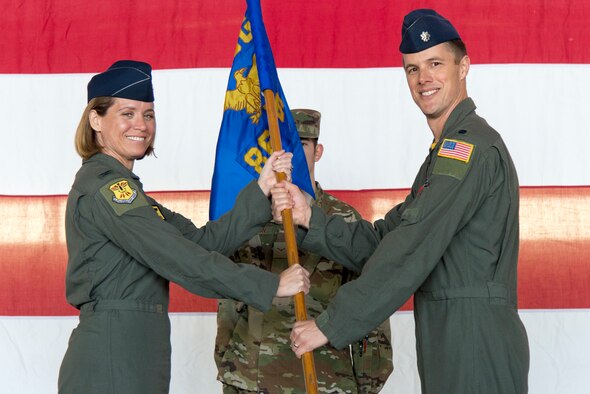 Lt. Col. Justin Wetterhall, 86th Flying Training Squadron commander, receives the guideon from Col. Carey Jones, 47th Operations Group commander, at Laughlin Air Force Base, Texas, Feb. 25, 2020. During the change of command ceremony, Wetterhall received the guideon, rendered his first salute, and discussed the squadron’s future during a quick speech to attendees.