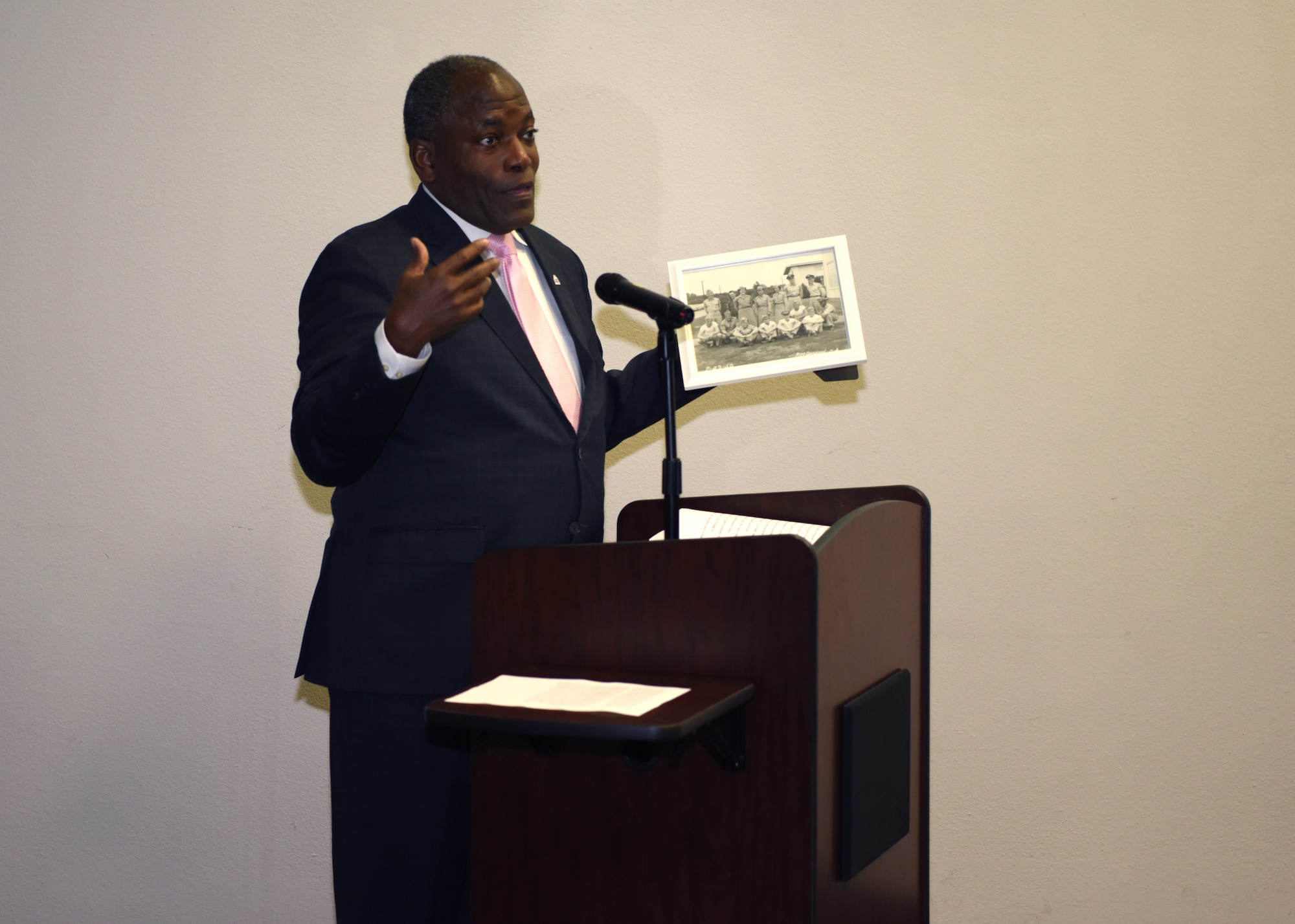 Retired Lt. Gen. Ronnie D. Hawkins, Jr. presents a photo of his father at Goodfellow Air Force Base in 1950 at the Black History Month event in the event center on Goodfellow Air Force Base, Texas, February 20, 2020. Hawkins spoke on the importance of black history in our military and the importance of diversity. (U.S. Air Force photo by Airman 1st Class Ethan Sherwood)