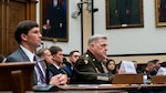 Defense Secretary Dr. Mark T. Esper and Army Gen. Mark A. Milley sit at a table.