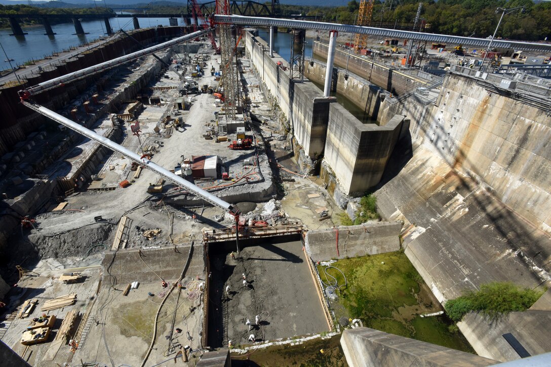 The U.S. Army Corps of Engineers Nashville District places concrete for the first monolith on the Chickamauga Lock Replacement Project Oct. 17, 2019 on the Tennessee River in Chattanooga, Tennessee. At the Chickamauga Lock Replacement Project, aa Tennessee Valley Authority project, the Nashville District is currently executing the lock chamber contract for the new 110-foot by 600-foot navigation lock, which includes 285,000 cubic yards of reinforced concrete. A conveyer system is placing concrete inside the coffer dam from the batch plant, a distance of about 900 feet in about a minute and a half. (USACE Photo by Lee Roberts)
