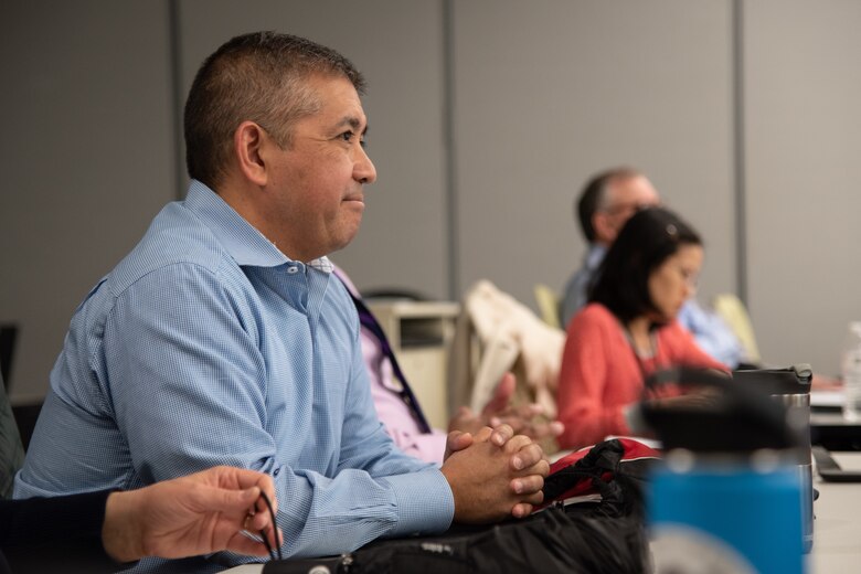 Eduardo Granados, U.S. Army Engineering and Support Center, Huntsville Ordnance and Explosives Global Operations Division chief, listens as project managers brief during the monthly Project Review Board Feb. 12 in Huntsville, Alabama. (Photo by Stephen Baack, Huntsville Center public affairs.)