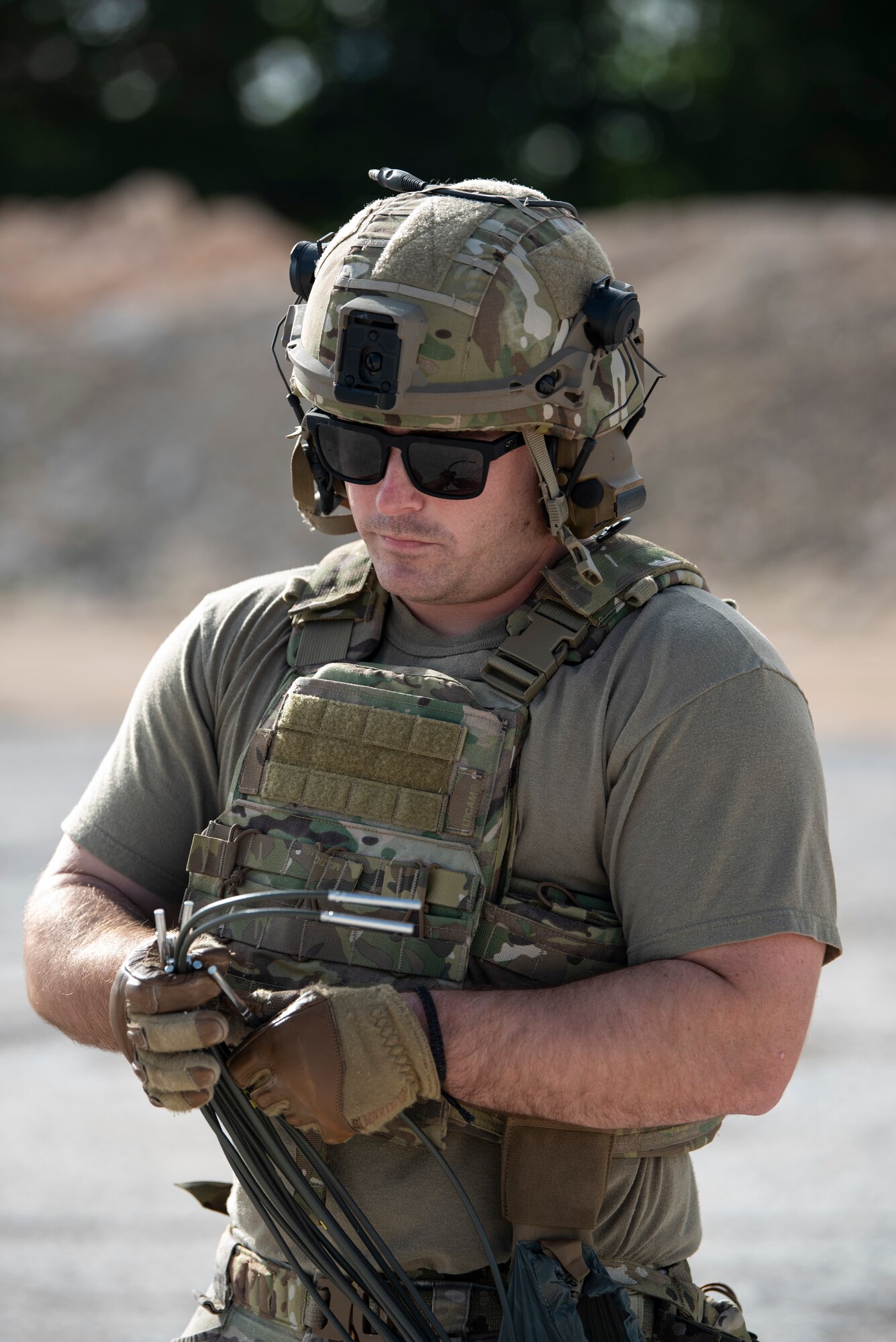 An Explosive Ordnance Disposal technician with the 36th Civil Engineer Squadron place explosives on the runway as part of a Rapid Airfield Damage Repair (RADR) Exercise at Andersen Air Force Base, Feb. 12, 2020.