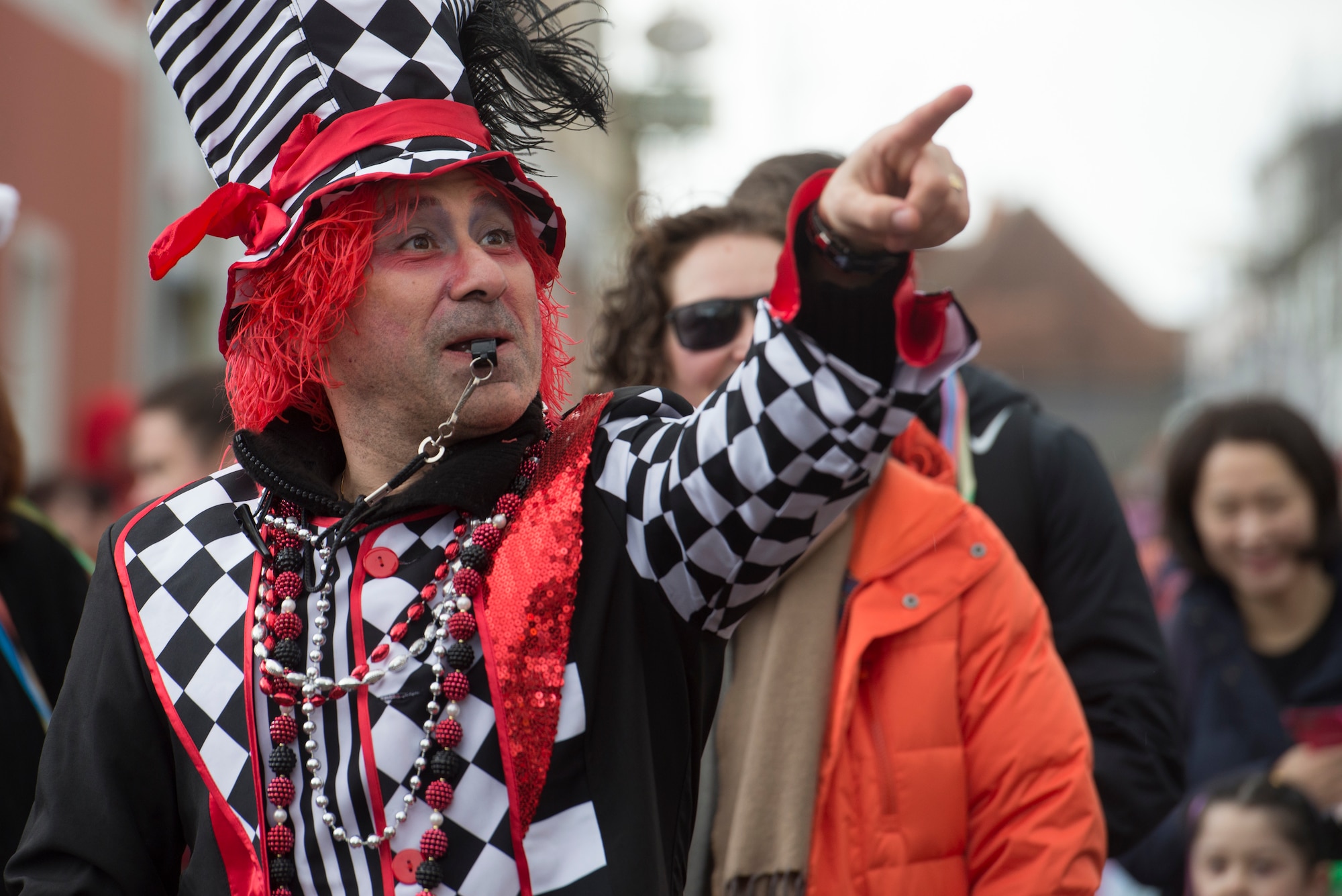 Man marches through a parade.