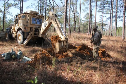 Soldiers from the 861st Engineer Support Company, Rhode Island National Guard, participate in Task Force Spartan Jan. 9-29, 2020, at the Joint Readiness Training Center at Fort Polk, La. They provided a variety of force protection measures in support of friendly forces, which included constructing berms for artillery and anti-tank ditches and route clearance missions.