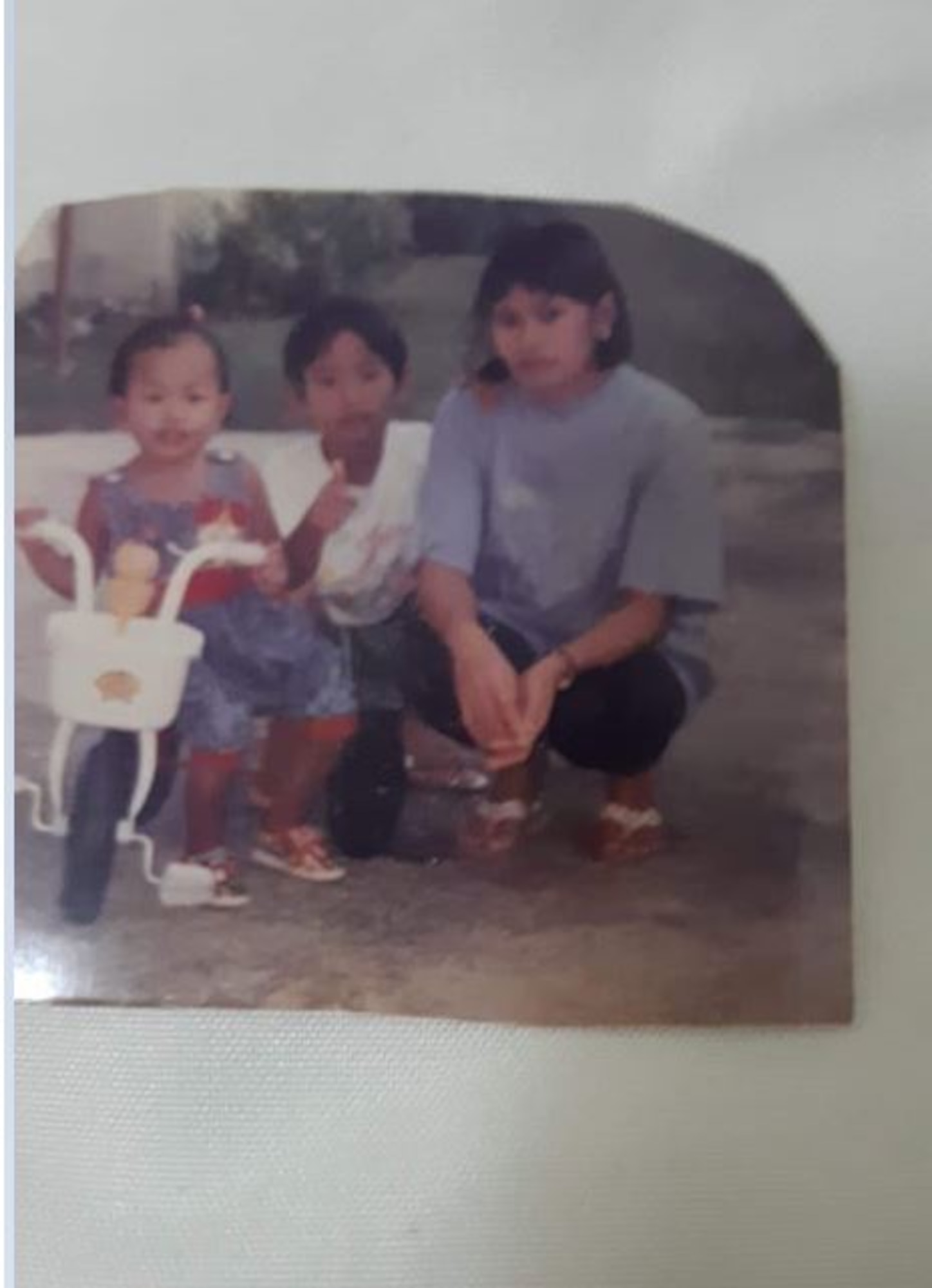 Jim Araos (center), poses for a family photo with his mother and sister, in Dededo, Guam, 1995. Araos now serves as 39th Air Base Wing Public Affairs office non-commissioned officer in charge of Community Engagement. (Courtesy Photo)