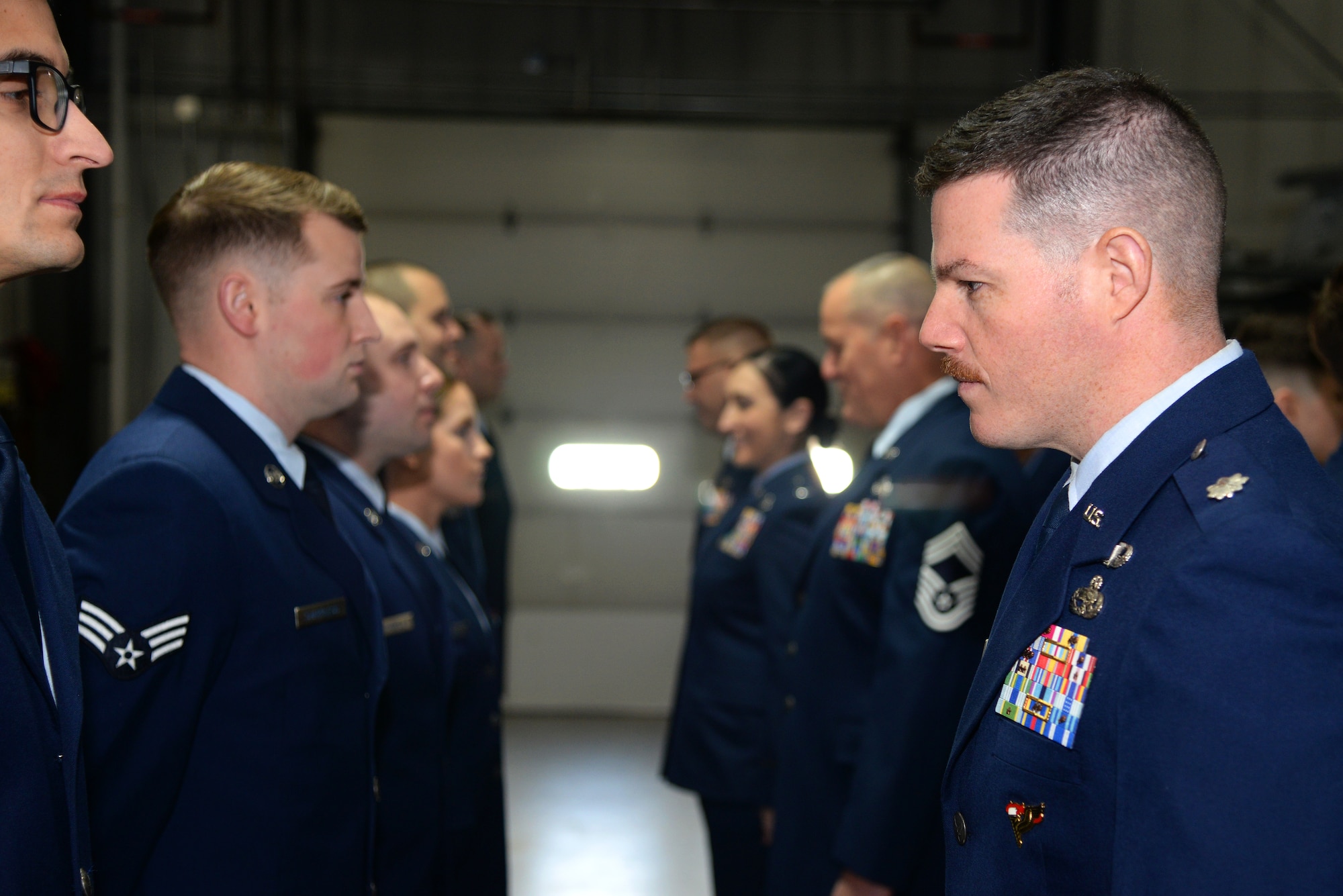 A picture of U.S. Air Force Lt. Col. Brian T. Cooper, commander of the 177th Maintenance Group, performing an open ranks inspection.