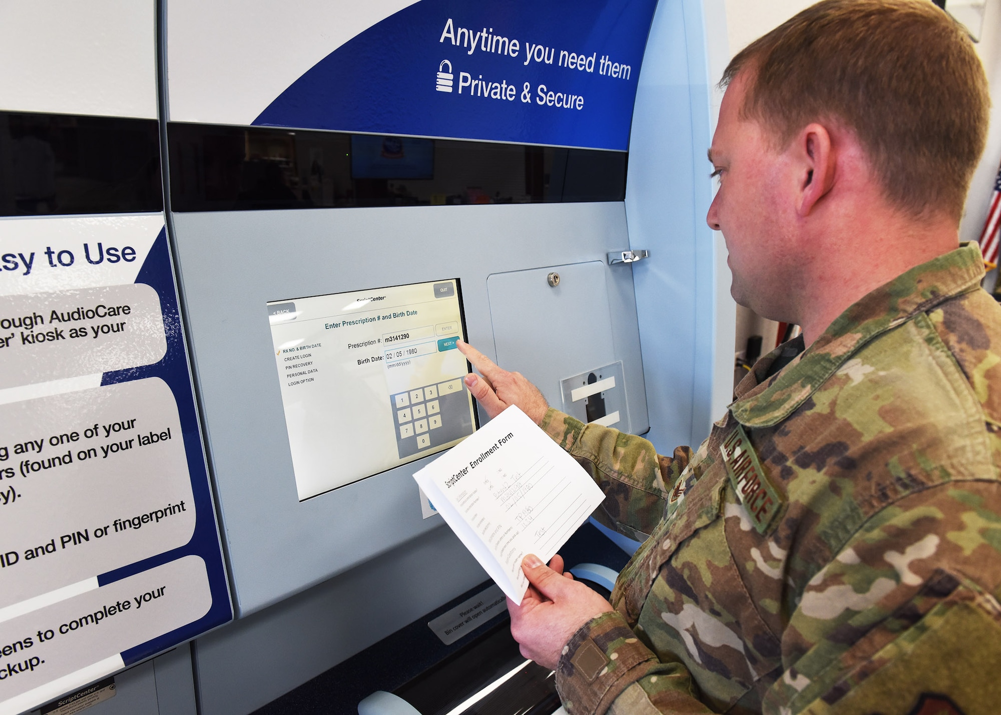 Staff Sgt. Dustin Stevens, 7th Medical Support Squadron pharmacy technician, uses test patient information to illustrate enrolling an account at the ScriptCenter at Dyess Air Force Base, Texas, Feb. 26, 2020.