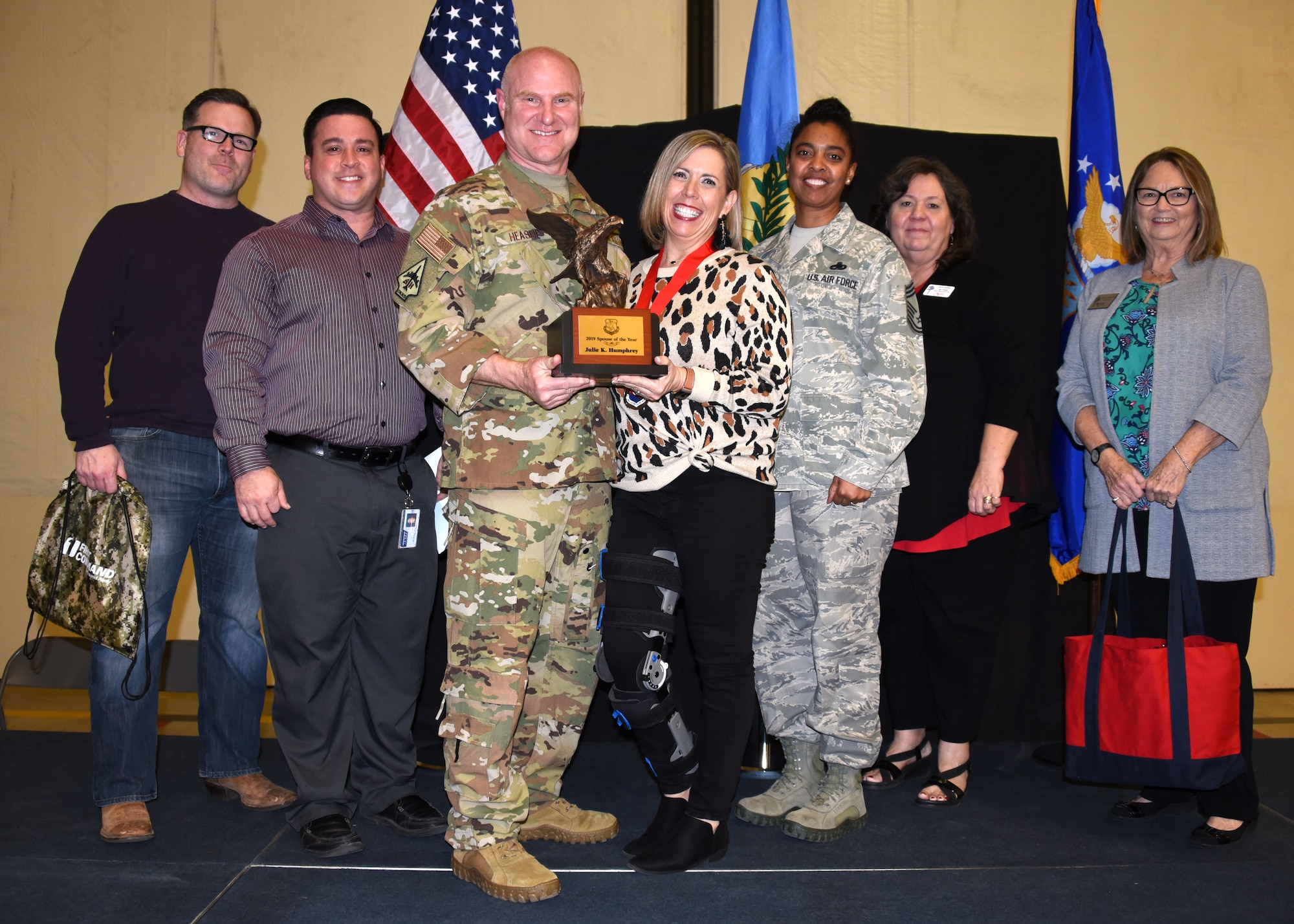 Julie Humphrey receives the 2019 507th Air Refueling Wing Spouse of the Year award from Col. Miles Heaslip, 507th ARW commander, during the 2019 Annual Awards Banquet Feb. 8, 2020, at Tinker Air Force Base, Oklahoma. (U.S. Air Force photo by Tech. Sgt. Samantha Mathison)