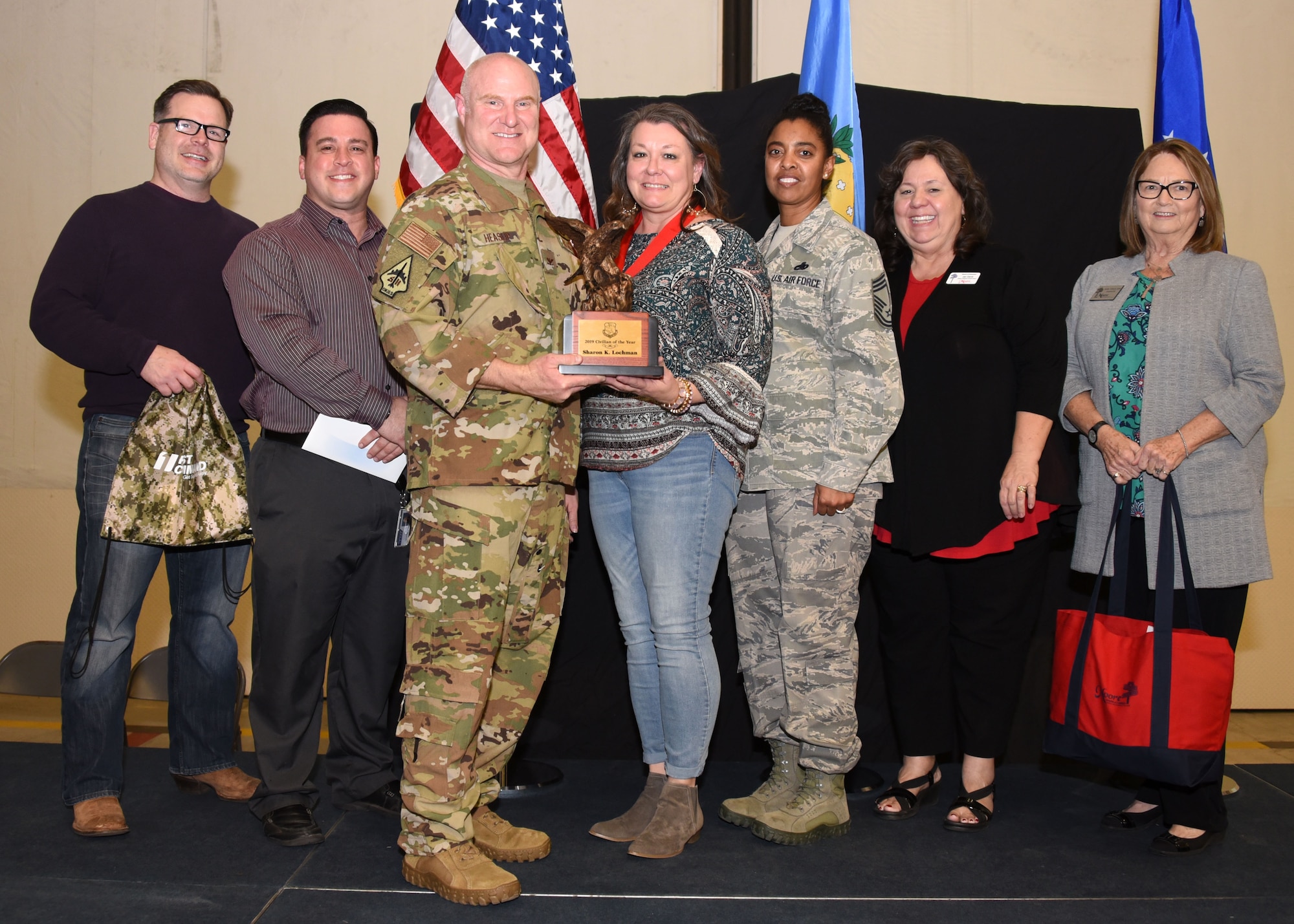 Sharon Lochman, 507th Force Support Squadron Airman and Family Readiness director, receives the 2019 507th Air Refueling Wing Civilian of the Year award from Col. Miles Heaslip, 507th ARW commander, during the 2019 Annual Awards Banquet Feb. 8, 2020, at Tinker Air Force Base, Oklahoma. (U.S. Air Force photo by Tech. Sgt. Samantha Mathison)