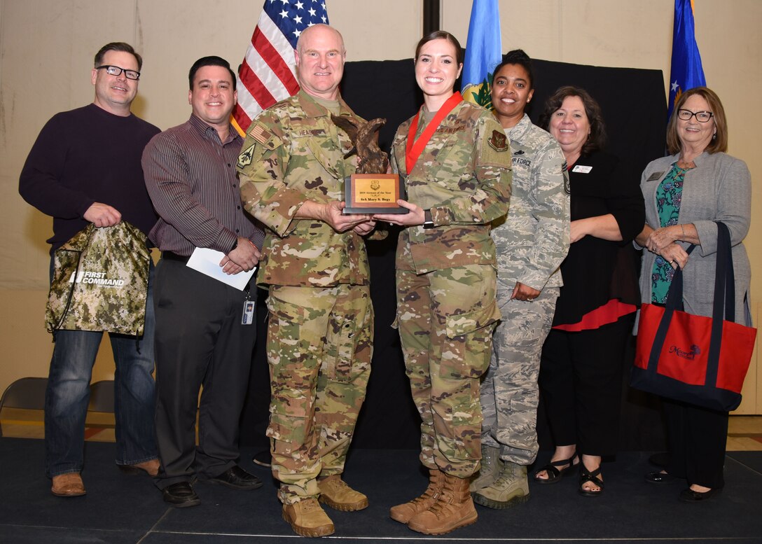 Senior Airman Mary Begy, 507th Air Refueling Wing Public Affairs broadcaster, receives the 2019 507th ARW Airman of the Year award from Col. Miles Heaslip, 507th ARW commander, during the 2019 Annual Awards Banquet Feb. 8, 2020, at Tinker Air Force Base, Oklahoma. (U.S. Air Force photo by Tech. Sgt. Samantha Mathison)