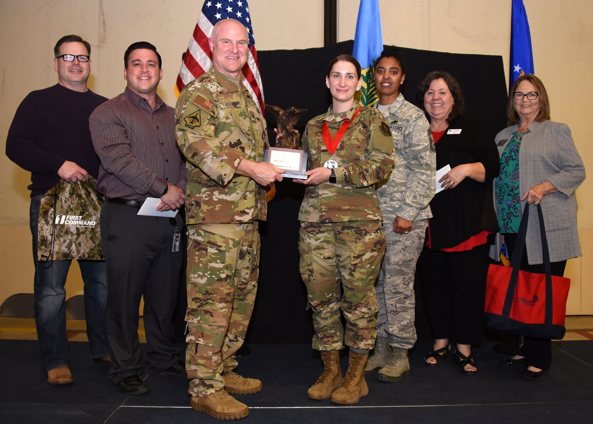 Master Sgt. Madison Harmon, 730th Air Mobility Training Squadron, receives the 2019 507th ARW SNCO of the Year award from Col. Miles Heaslip, 507th ARW commander, during the 2019 Annual Awards Banquet Feb. 8, 2020, at Tinker Air Force Base, Oklahoma. (U.S. Air Force photo by Tech. Sgt. Samantha Mathison)
