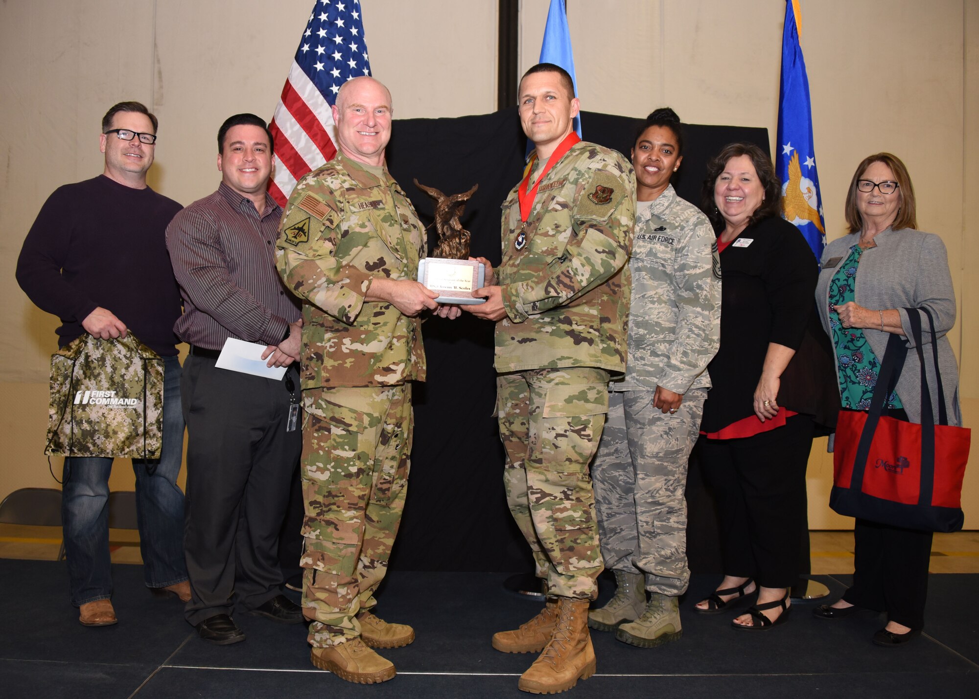 Master Sgt. Jeremy Scoles, 507th Logistics Readiness Squadron first sergeant, receives the 2019 507th ARW First Sergeant of the Year award from Col. Miles Heaslip, 507th ARW commander, during the 2019 Annual Awards Banquet Feb. 8, 2020, at Tinker Air Force Base, Oklahoma. (U.S. Air Force photo by Tech. Sgt. Samantha Mathison)