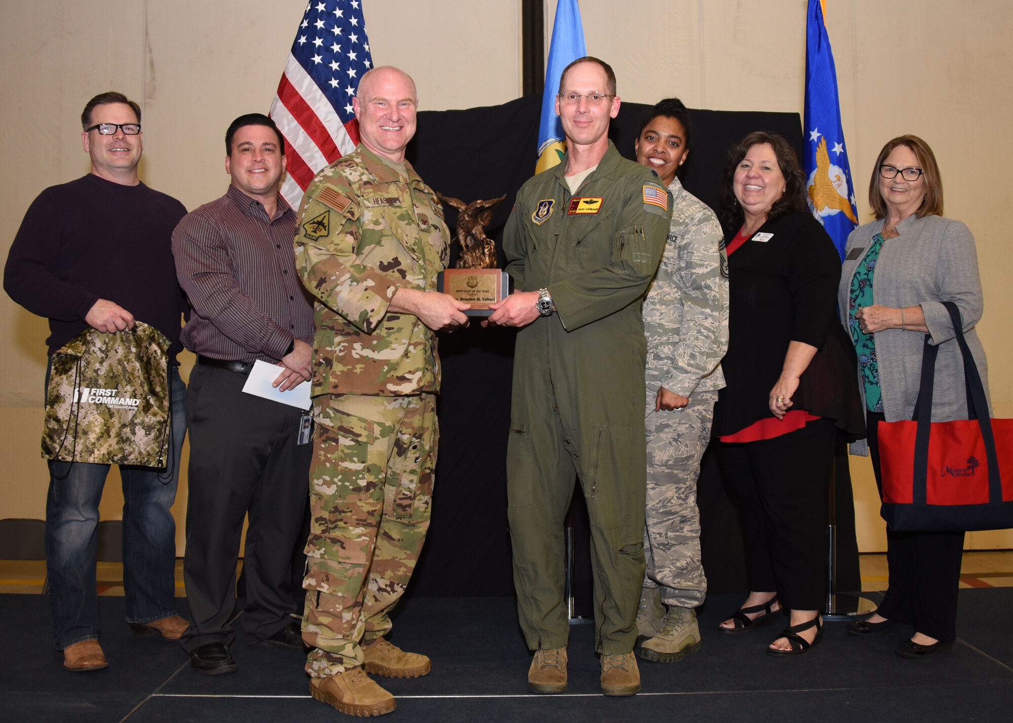 Lt. Col. Marvin Ashbaker, 465th Air Refueling Squadron director of operations, receives the 2019 507th ARW CGO of the Year award on behalf of Capt. Brenden Valenti, 465th ARS mobility pilot, from Col. Miles Heaslip, 507th ARW commander, during the 2019 Annual Awards Banquet Feb. 8, 2020, at Tinker Air Force Base, Oklahoma. (U.S. Air Force photo by Tech. Sgt. Samantha Mathison)