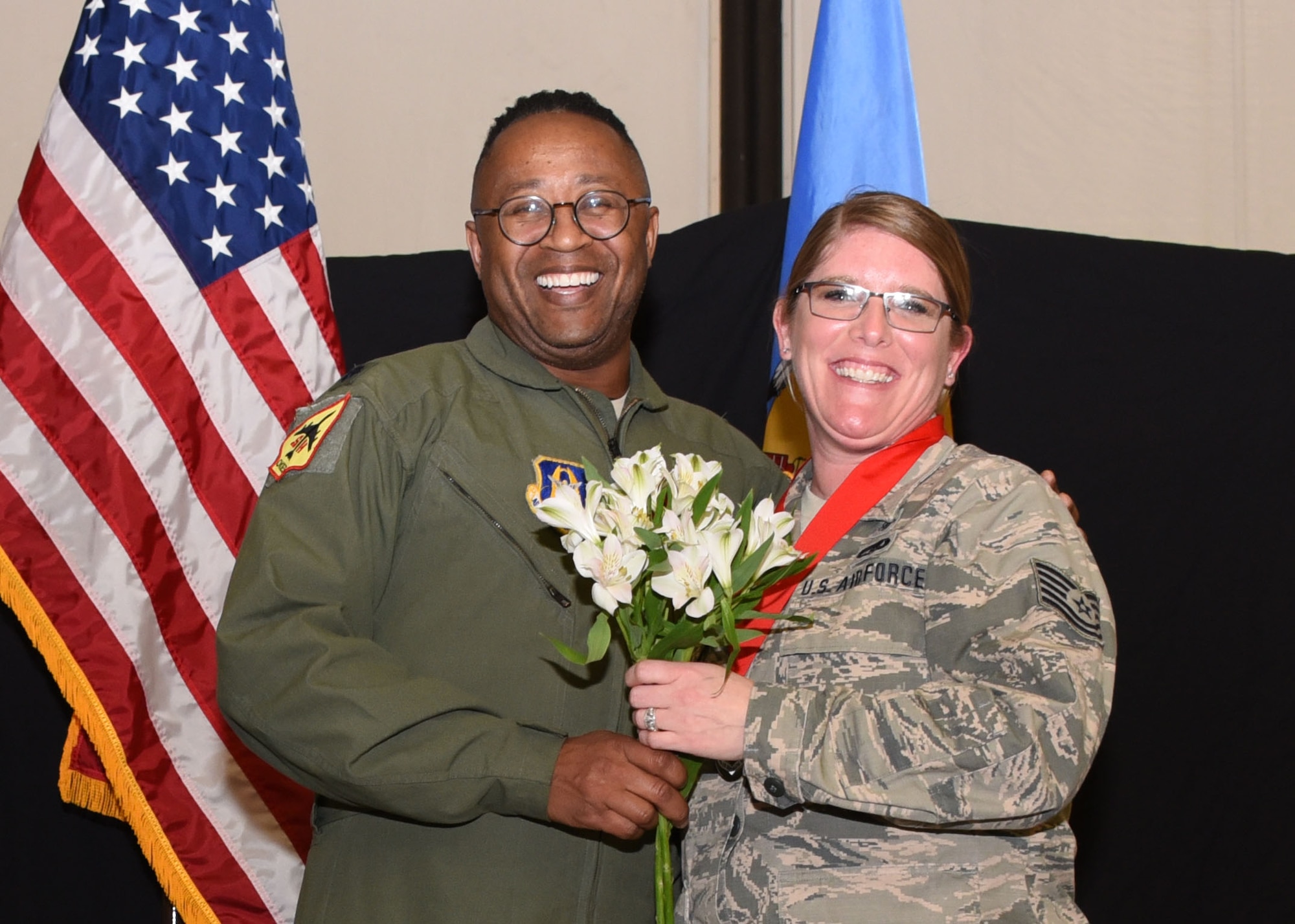 Tech. Sgt. Bridget Goodknight, 507th Medical Squadron NCOIC outpatient records, is recognized by Lt. Col. Alvin Bradford, 507th MDS commander, during the 2019 Annual Awards Banquet Feb. 8, 2020, at Tinker Air Force Base, Oklahoma. (U.S. Air Force photo by Tech. Sgt. Samantha Mathison)
