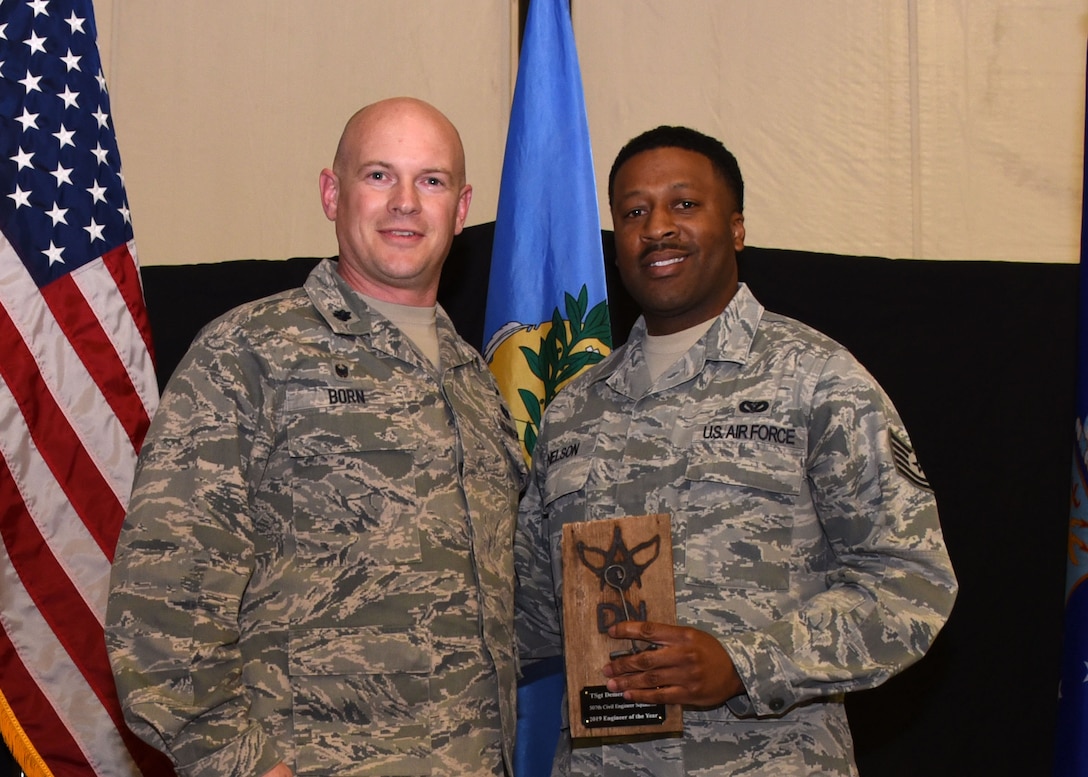 Tech. Sgt. Demerious Nelson, 507th Civil Engineer Squadron, is recognized as the 2019 507th CES Civil Engineer of the Year by Lt. Col. Dustin Born, 507th CES commander, during the 2019 Annual Awards Banquet Feb. 8, 2020, at Tinker Air Force Base, Oklahoma. (U.S. Air Force photo by Tech. Sgt. Samantha Mathison)