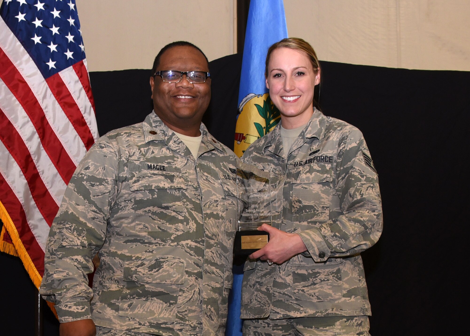Staff Sgt. Jennifer Wagoner, 507th Force Support Squadron, receives the 2019 507th FSS Summit Award from Maj. Christopher Magee, 507th FSS operations officer, during the 2019 Annual Awards Banquet Feb. 8, 2020, at Tinker Air Force Base, Oklahoma. (U.S. Air Force photo by Tech. Sgt. Samantha Mathison)