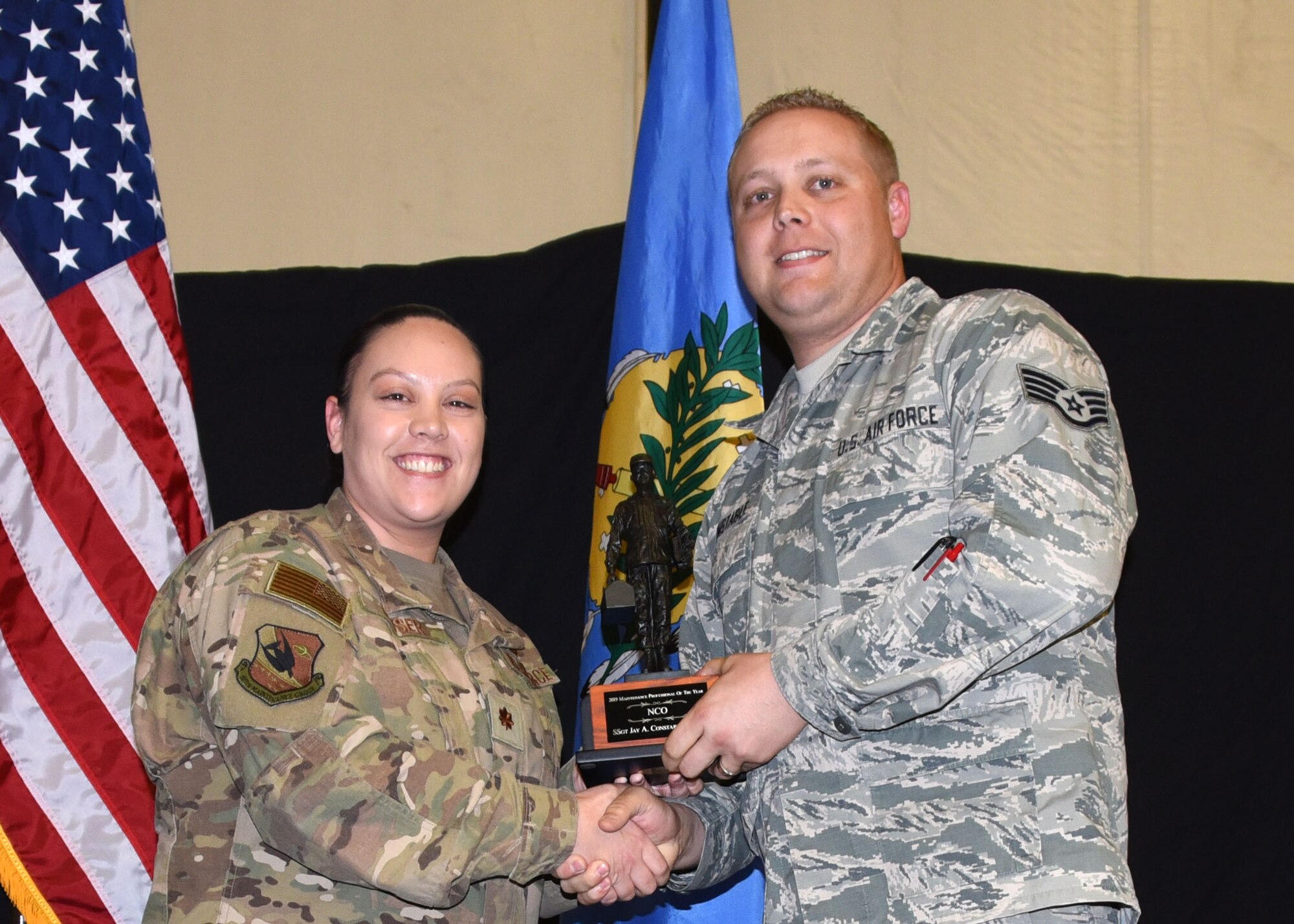 Staff Sgt. Jay Constable, 507th Aircraft Maintenance Squadron, receives the 2019 507th Maintenance Group Maintenance Professional of the Year award from Maj. Kristine Corser, 507th Maintenance Group operations officer, during the 2019 Annual Awards Banquet Feb. 8, 2020, at Tinker Air Force Base, Oklahoma. (U.S. Air Force photo by Tech. Sgt. Samantha Mathison)