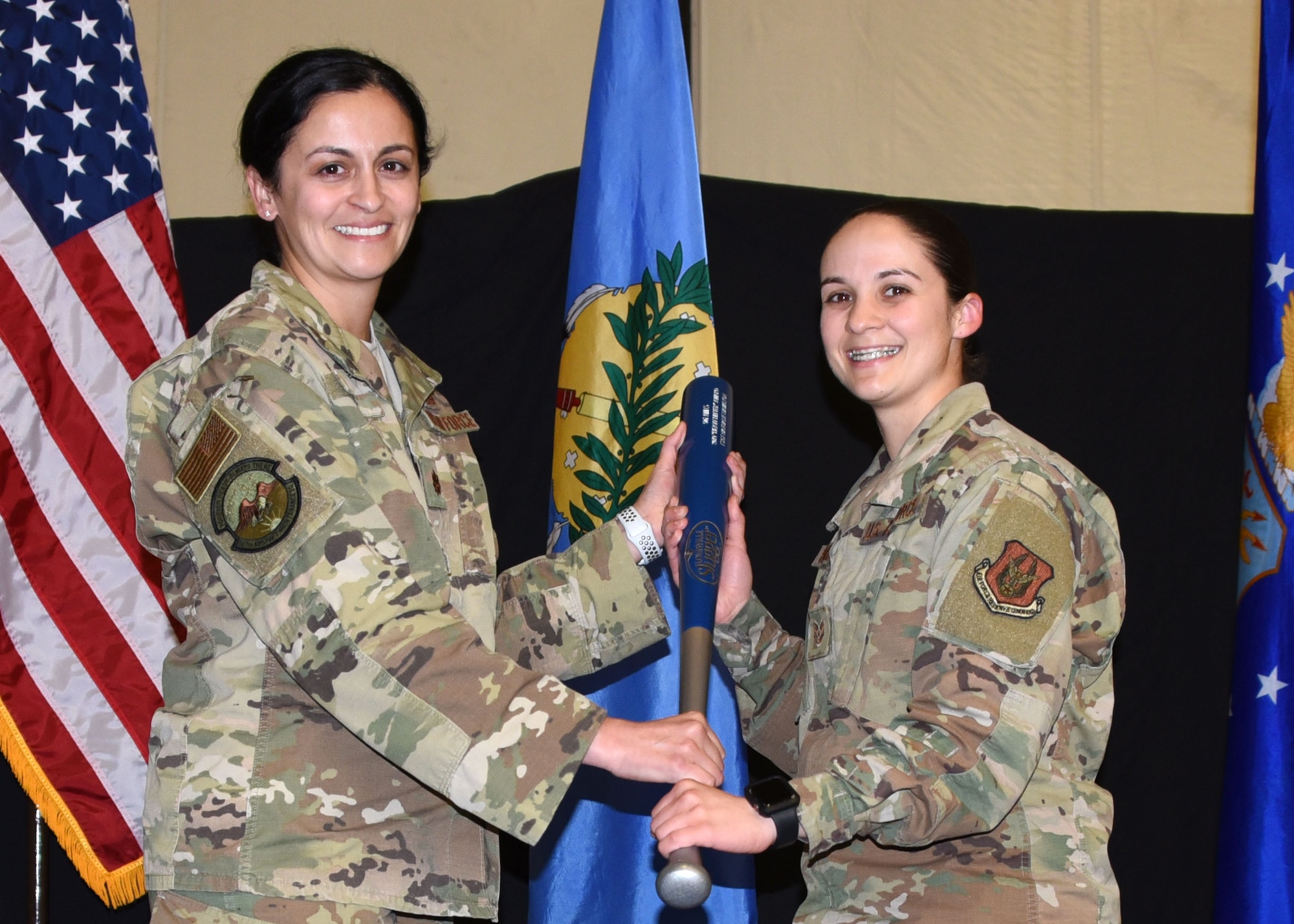 Tech. Sgt. Nathalie Hamilton, 507th Aircraft Maintenance Squadron, receives the 2019 507th AMXS Heavy Hitter Award from Maj. Cassandra Espy, 507th AMXS commander, during the 2019 Annual Awards Banquet Feb. 8, 2020, at Tinker Air Force Base, Oklahoma. (U.S. Air Force photo by Tech. Sgt. Samantha Mathison)