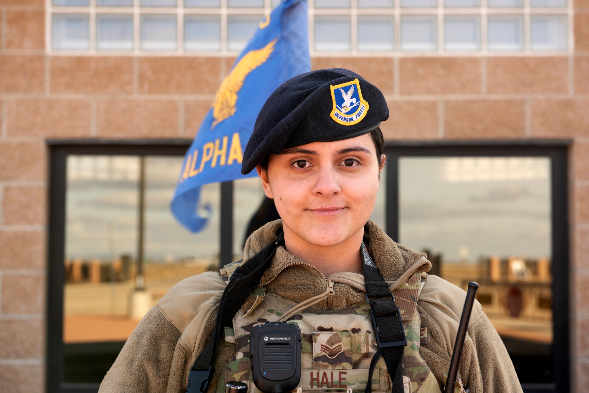 U.S. Air Force SrA Anna Hale, 366th Security Forces Squadron response force leader, stands in front of the main gate Feb. 24, 2019, on Mountain Home Air Force Base, Idaho. Hale is one of seven women in Security Forces who were issued the new female cut plate carrier. (U.S. Air Force photo by Airman Natalie Rubenak)