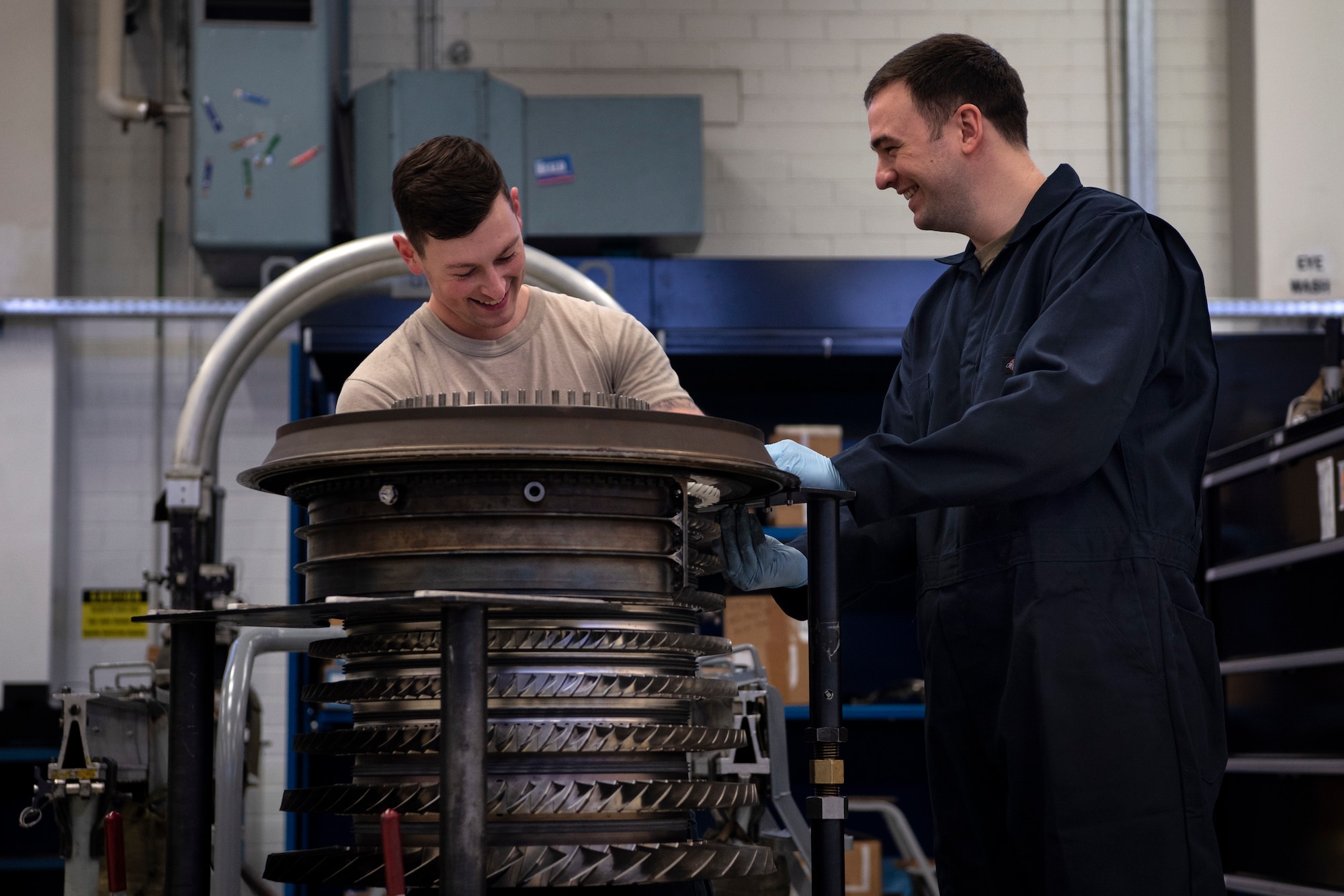 U.S. Air Force Staff Sgts. John Roberts and Taylor Bowes, both 52nd Maintenance Squadron aerospace propulsion craftsmen, build an F110-GE-100 jet engine compressor at Spangdahlem Air Base, Germany, Feb. 25, 2020. The propulsion flight is in charge of providing engines to multiple units, not just the 52nd Fighter Wing. GE-100 series engines are not used at Spangdahlem AB, but are sent to Aviano AB, Italy, and the U.S. Air Forces Central Command theater of operations. (U.S. Air Force photo by Airman 1st Class Valerie Seelye)