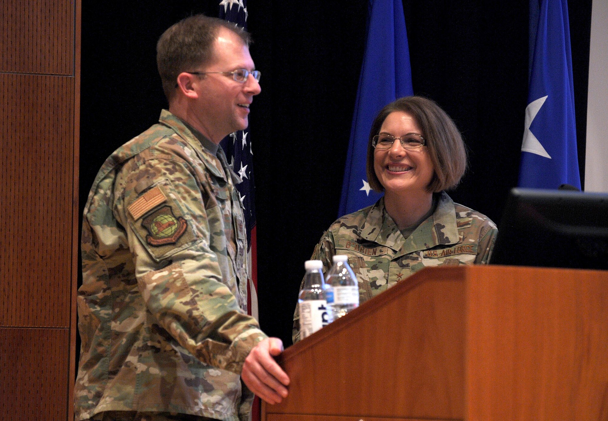 U.S. Air Force Col. Parker Wright, National Air and Space Intelligence Center commander, introduces Lt. Gen. Mary F. O’Brien, Deputy Chief of Staff for Intelligence, Surveillance, Reconnaissance and Cyber Effects Operations, to the members of NASIC during a town hall on Wright-Patterson AFB, Ohio, 23 Jan. 2020. During her briefing, General O’Brien spoke on topics such as the projected avenues of improvement for the intelligence community, the formation of the United States Space Force and the importance of strong diverse teams. (U.S. Air Force photo Staff Sgt. Seth Ray Stang)