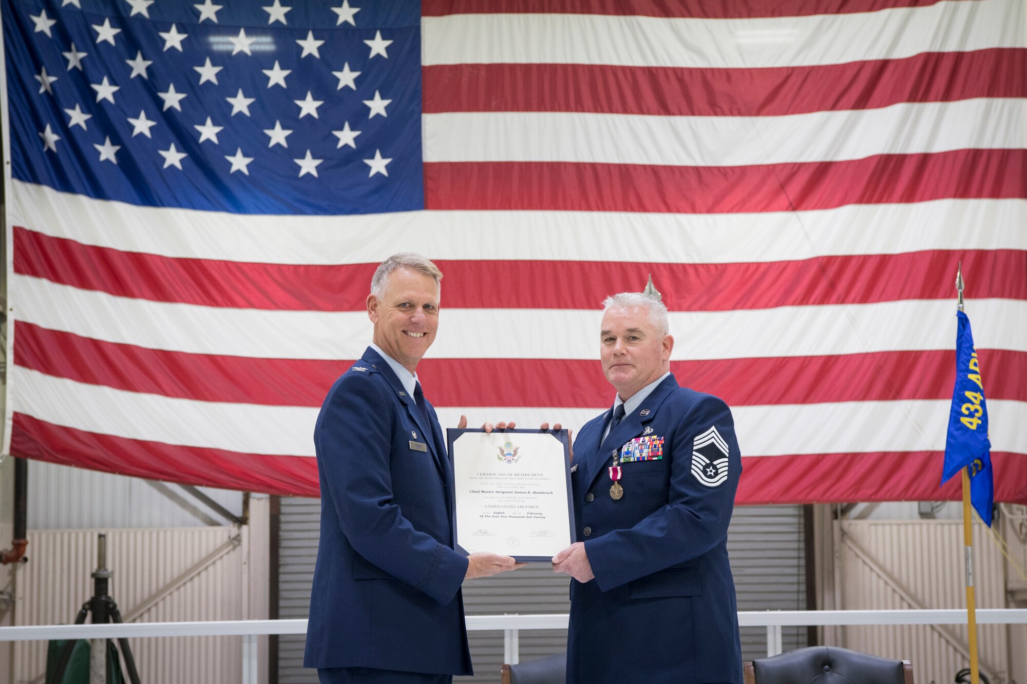 Chief Master Sgt. James Hambruch, 434th Aircraft Maintenance Squadron assistant superintendent, receives his retirement certificate from Col. Larry Shaw, 434th Air Refueling Wing commander, during a retirement ceremony at Grissom Air Reserve Base, Indiana, Feb. 08, 2020. Prior to Hambruch’s Air Force Reserve duty he served on active duty for eight years. (U.S. Air Force photo/Master Sgt. Ben Mota)