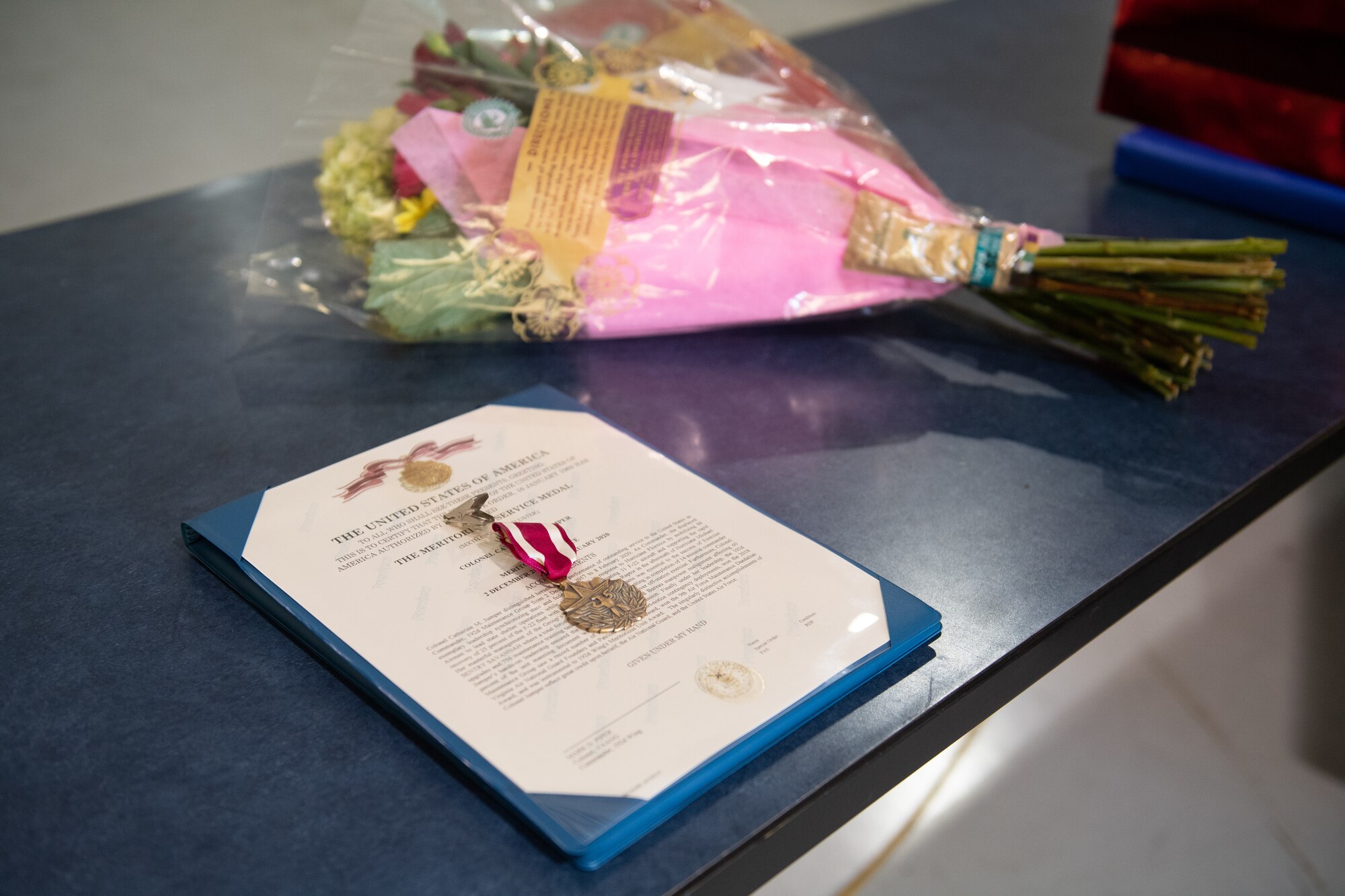 Awards on a table and flowers