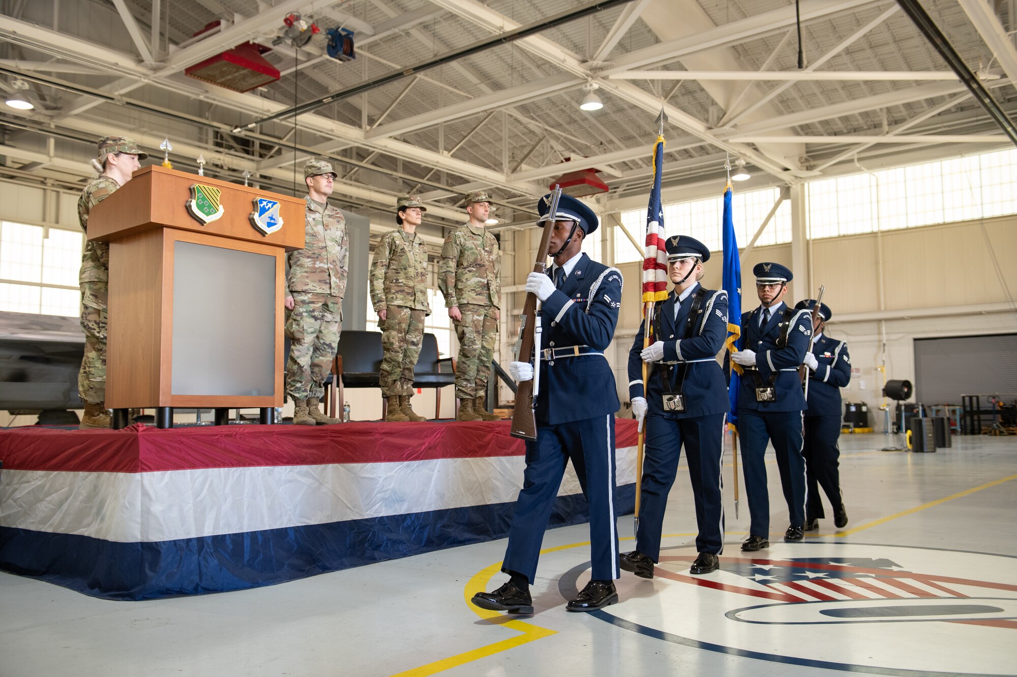 A color guard marches in with the flag