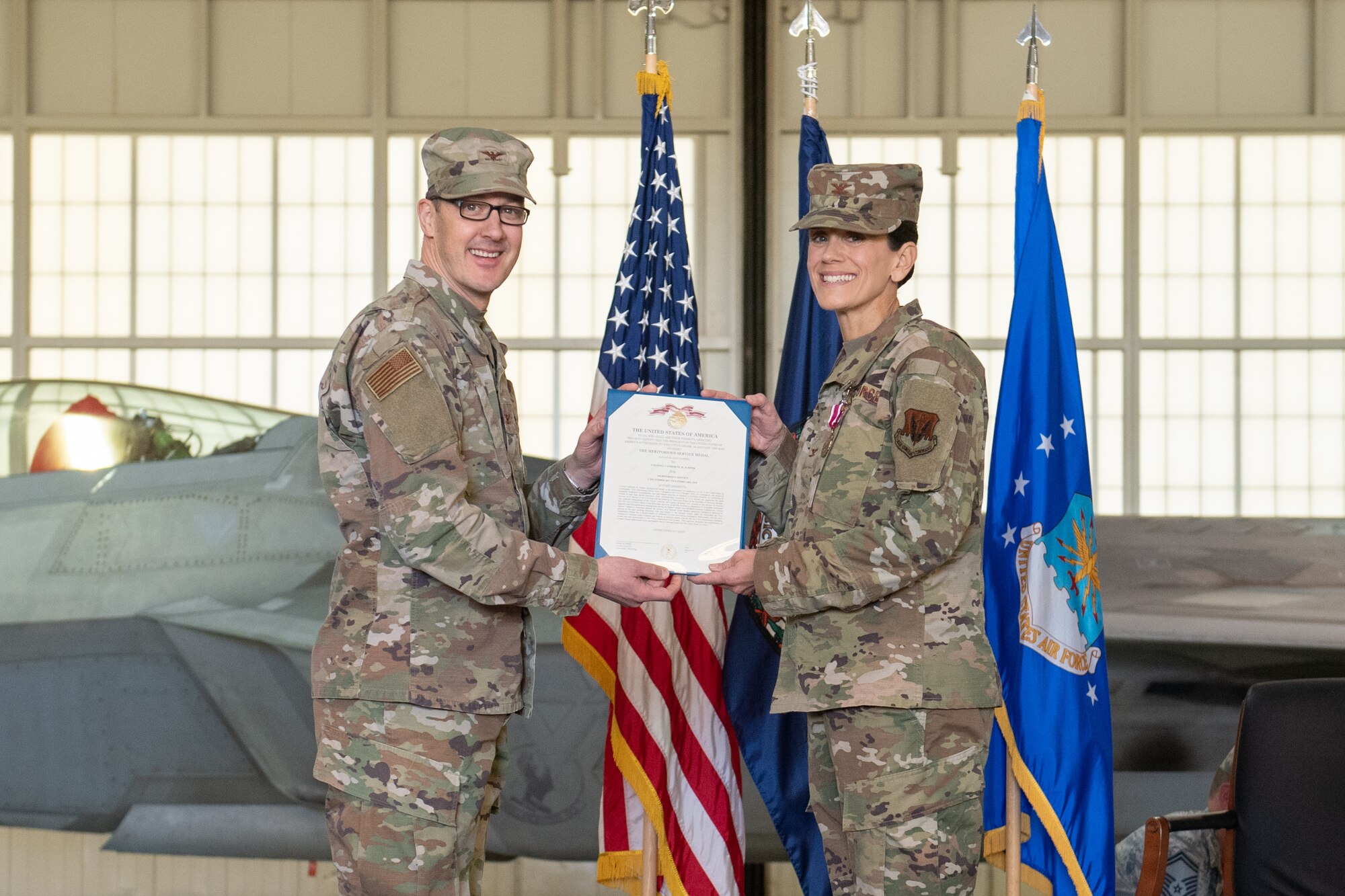 Officer presents an award to another officer