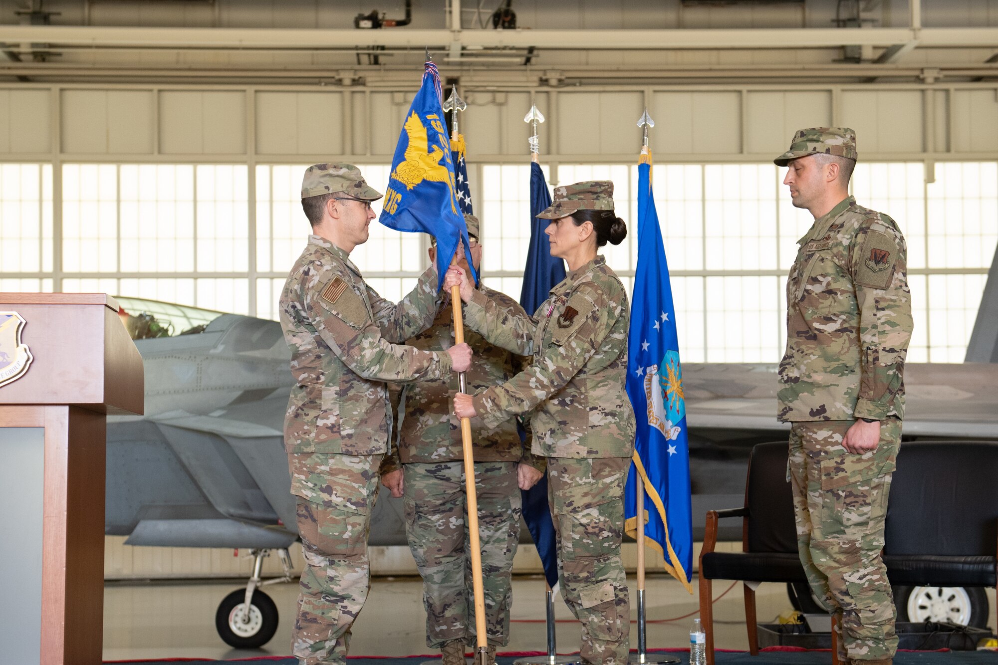 Two officers exchange guidon flag