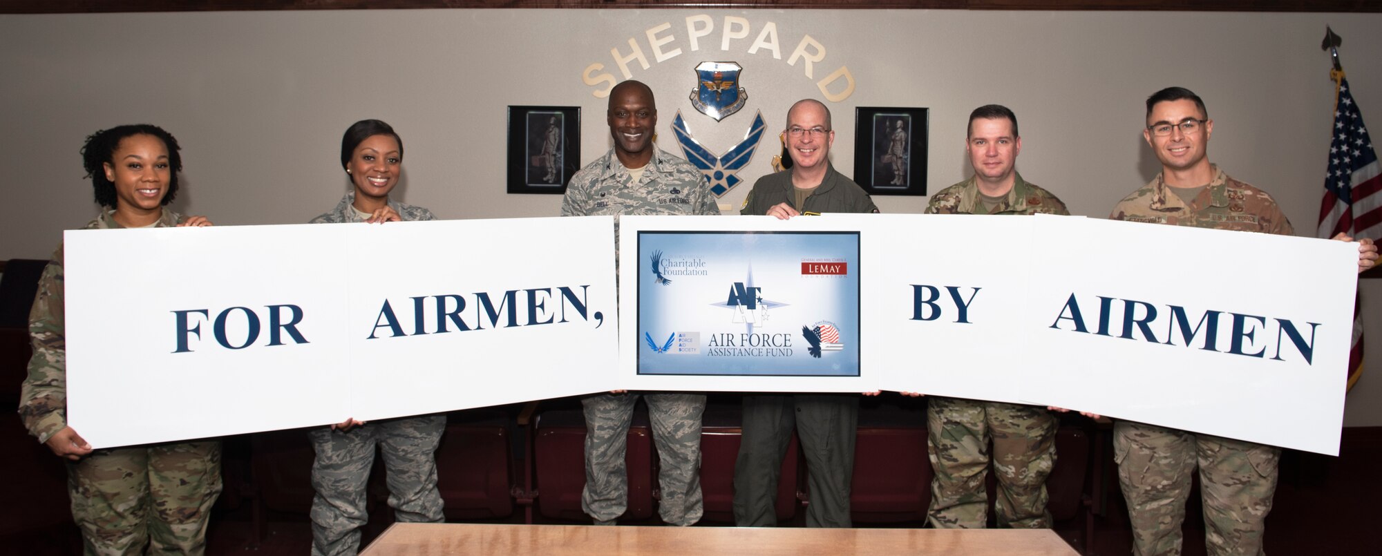 Sheppard's Air Force Assistance Fund leaders pose for a photo with the 82nd Training Wing and 80th Flying Training Wing commanders and command chiefs at Sheppard Air Force Base, Texas, Feb. 27, 2020. The AFAF charitable drive will kick off March 2 through April 10, 2020. (U.S. Air Force photo by Senior Airman Pedro Tenorio)