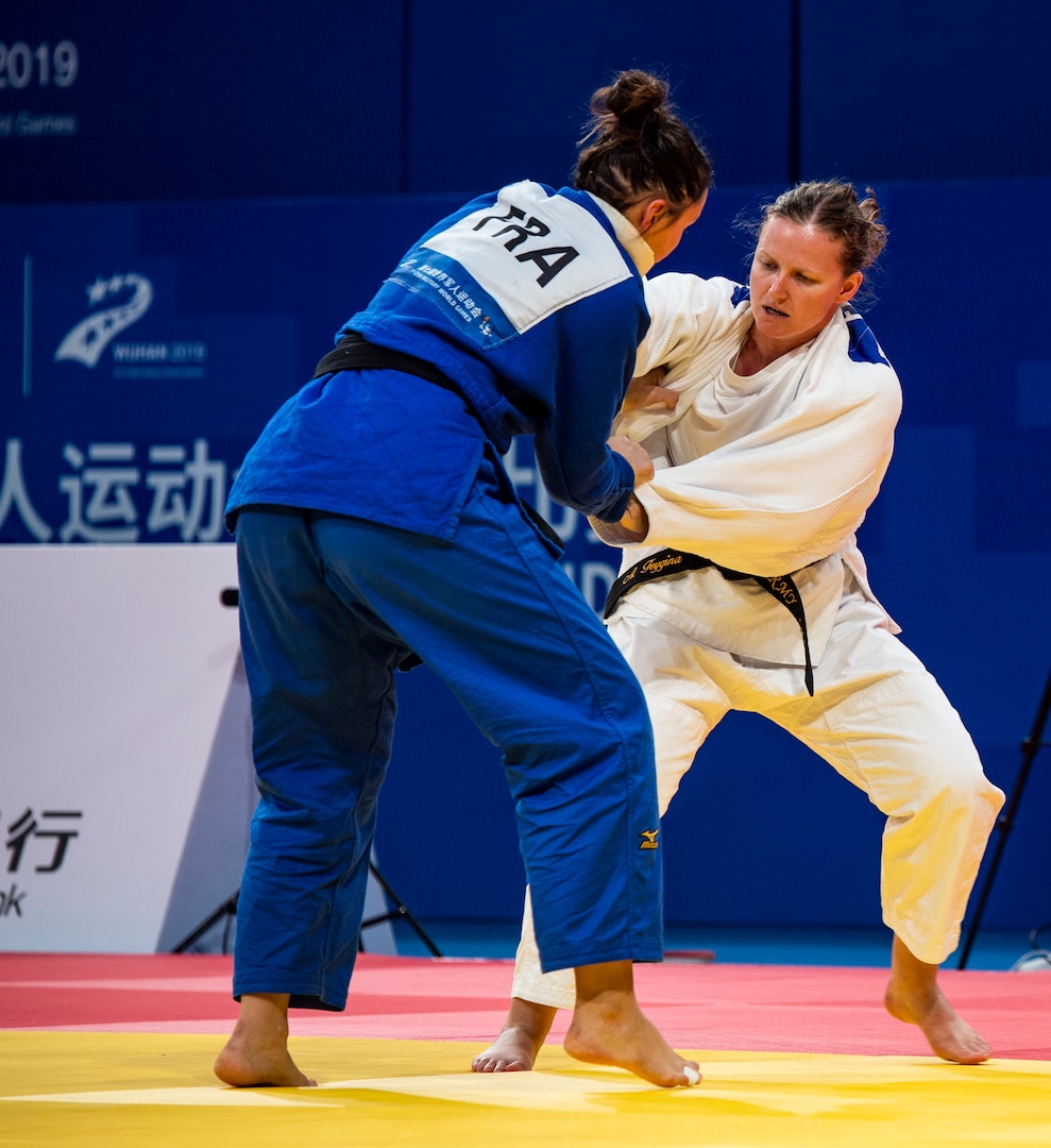 U.S. Army Capt. Anna Feygina, United States Armed Forces Military World Games team judo competitor, attempts to throw an opponent during the Conseil International du Sport Militaire Judo competion in Wuhan China, Oct. 20, 2019. The 7th MWG will feature military athletes from around the world with an estimated participation of more than 100 nations and more than 10,000 participants. (U.S. Department of Defense photo by Staff Sergeant James R. Crow)