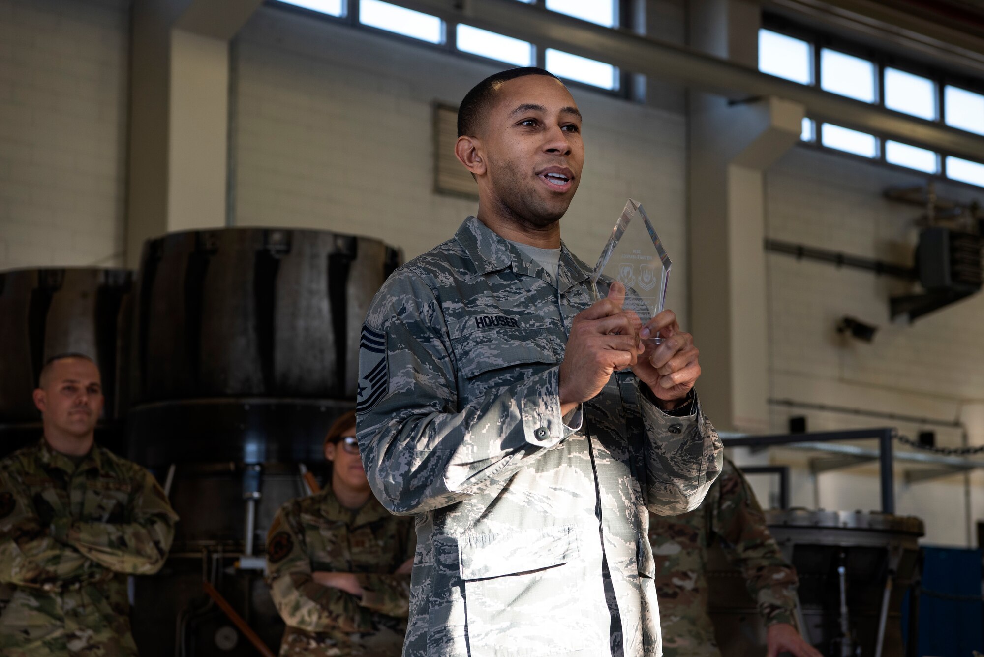 U.S. Air Force Chief Master Sgt. Willie Houser, 52nd Maintenance Squadron wing propulsion system manager, holds an award at Spangdahlem Air Base, Germany, Feb. 6, 2020. The 52nd MXS Propulsion Flight won the Air Force Chief of Safety: Aviation Maintenance Safety Award for supporting aircraft sortie generation with an excellent record of quality assurance. (U.S. Air Force photo by Airman 1st Class Valerie Seelye)