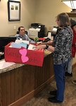 Employee can box of valentines to receptionist at veterans home