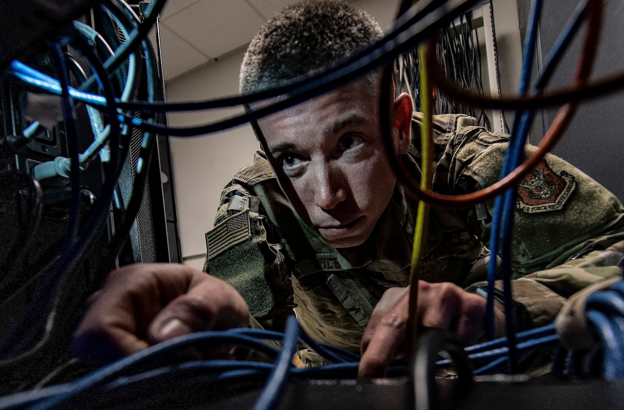 Tech. Sgt. Andrew Wilson, 911th Communications Squadron mission defense team member, checks the connection of wires on a server at the Pittsburgh International Airport Air Reserve Station, Pennsylvania, Feb. 4, 2020.