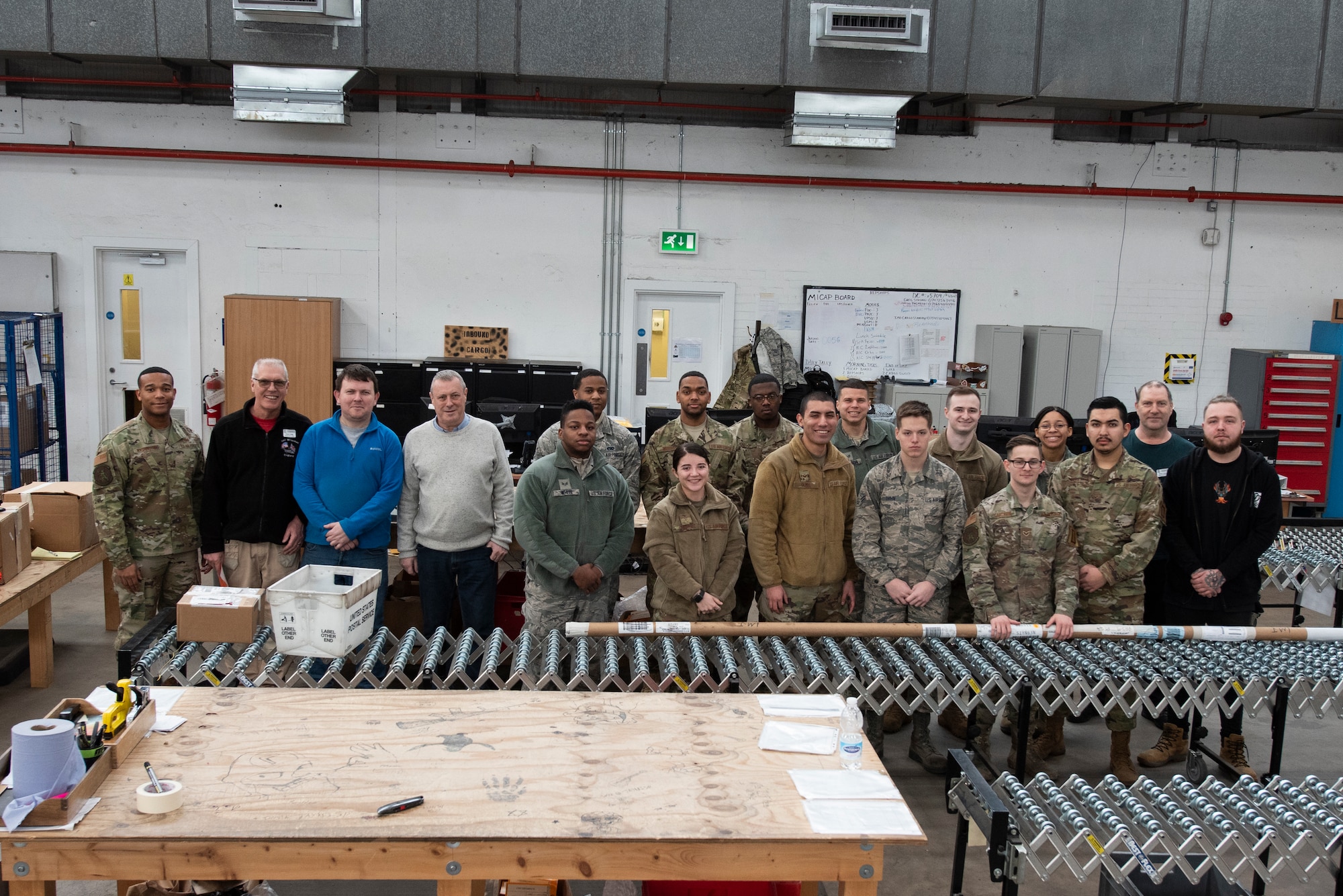 Traffic management and materials management Airmen from the 100th Logistics Readiness Squadron pose for a group photo Feb. 26, 2020, at RAF Mildenhall, England. The traffic management office is responsible for all cargo entering and leaving the base and helps to ensure mission success for Airmen on installation as well as downrange. (U.S. Air Force photo by Airman 1st Class Joseph Barron)