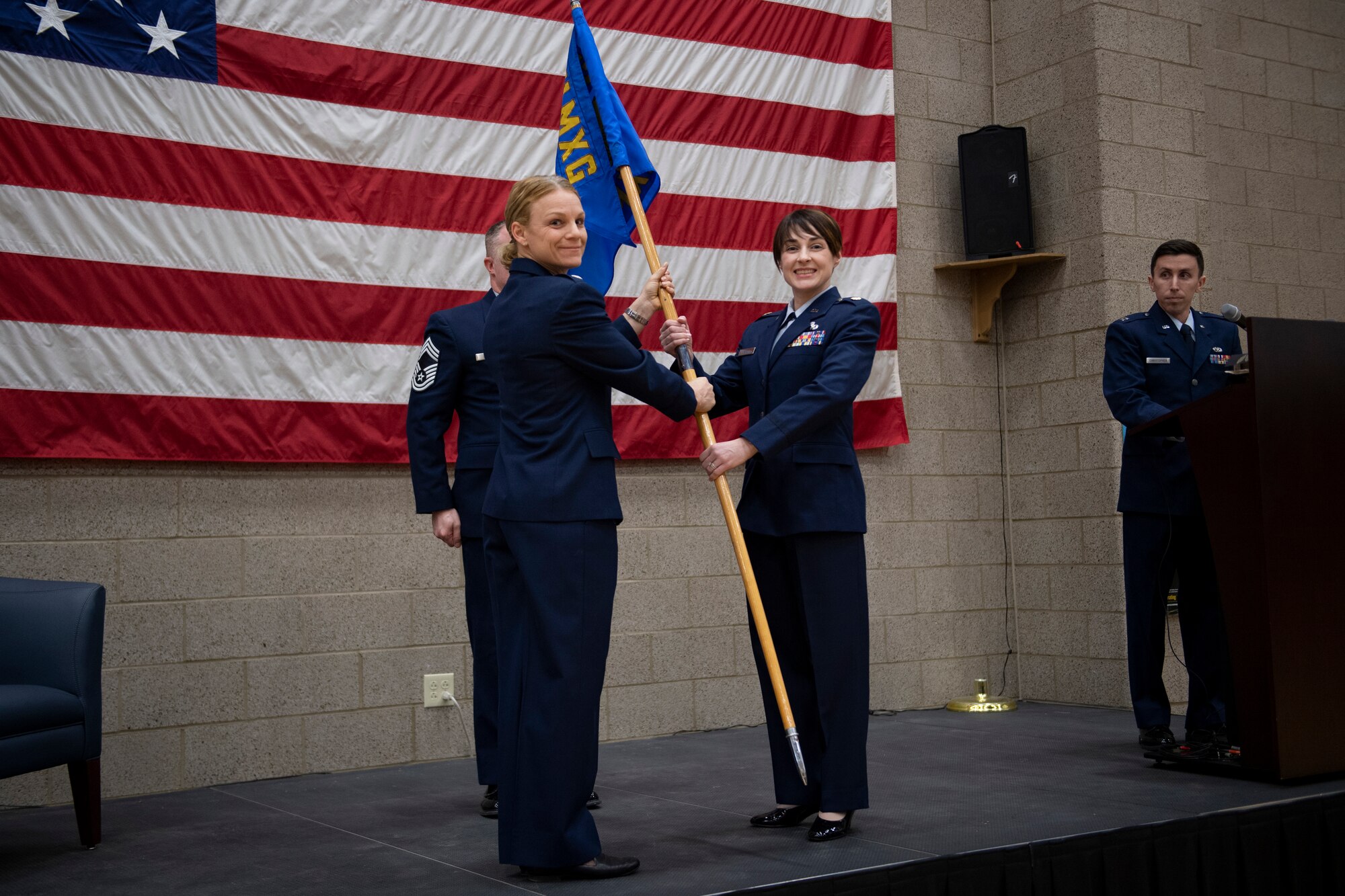Maj. Shelly A. Martin, 911th Maintenance Squadron commander, receives the squadron guidon from Lt. Col. Katrine Waterman, 911th Maintenance Group commander, during an assumption of command ceremony at the Pittsburgh International Airport Air Reserve Station, Feb. 8, 2020.