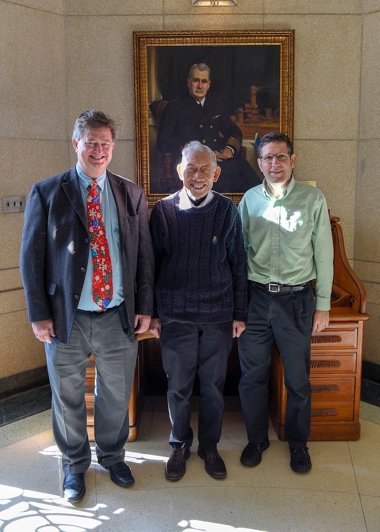 Naval Surface Warfare Center Carderock Division engineers David Hess, Dr. Young Shen and Michael Hughes share a moment together in Shen’s final week with the command at West Bethesda, Md., on Dec. 11, 2019.