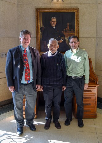 Naval Surface Warfare Center Carderock Division engineers David Hess, Dr. Young Shen and Michael Hughes share a moment together in Shen’s final week with the command at West Bethesda, Md., on Dec. 11, 2019.