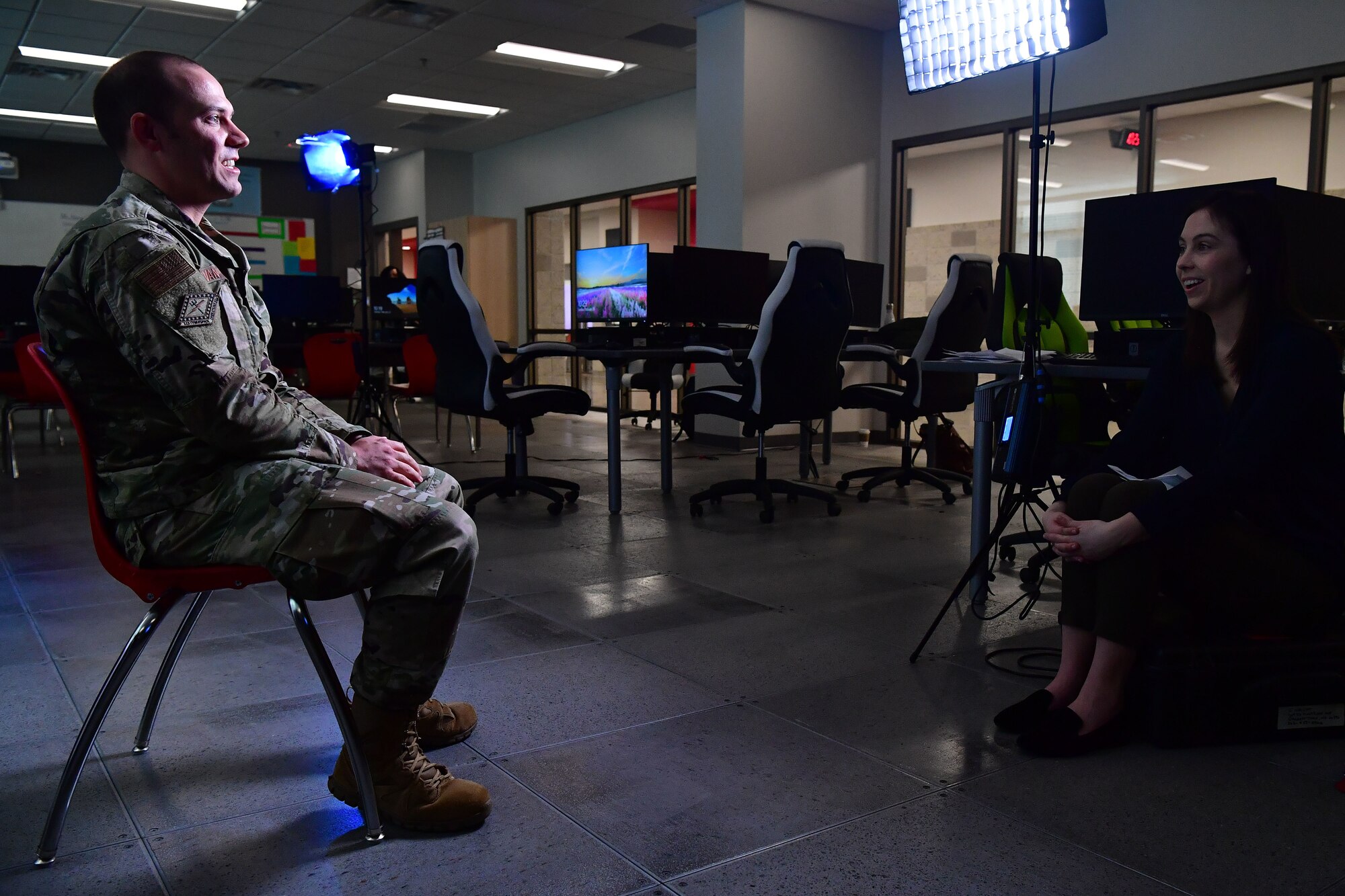 Grace Marvin, Association of Defense Communities director of communications, conducts an interview with U.S. Air Force 1st Lt. Thomas Van Dorple, 223rd Cyberspace Operations Squadron flight commander.