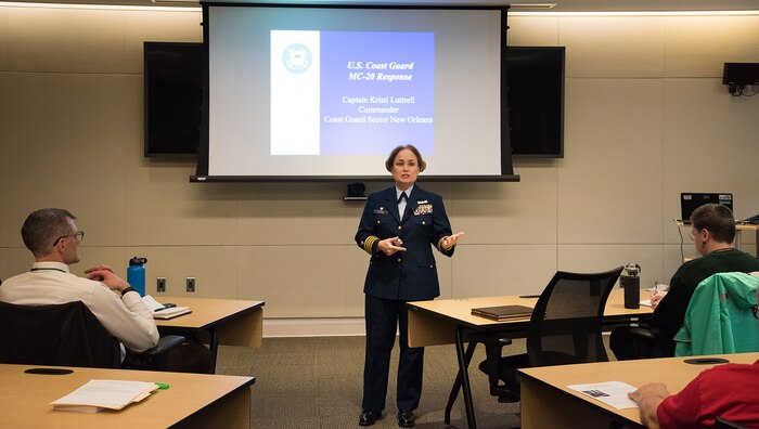 Engineers Week guest speaker Capt. Kristi M. Luttrell, Commander, Coast Guard Sector New Orleans, discusses her topic, “A Volcano of Oil at the Bottom of the Gulf,” with Naval Surface Warfare Center Carderock Division.