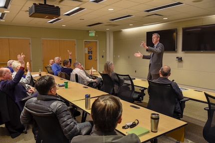 Naval Surface Warfare Center (NSWC) Crane Division Technical Director Dr. Brett Seidle quizzes employees on leadership qualities during his presentation at NSWC Carderock.