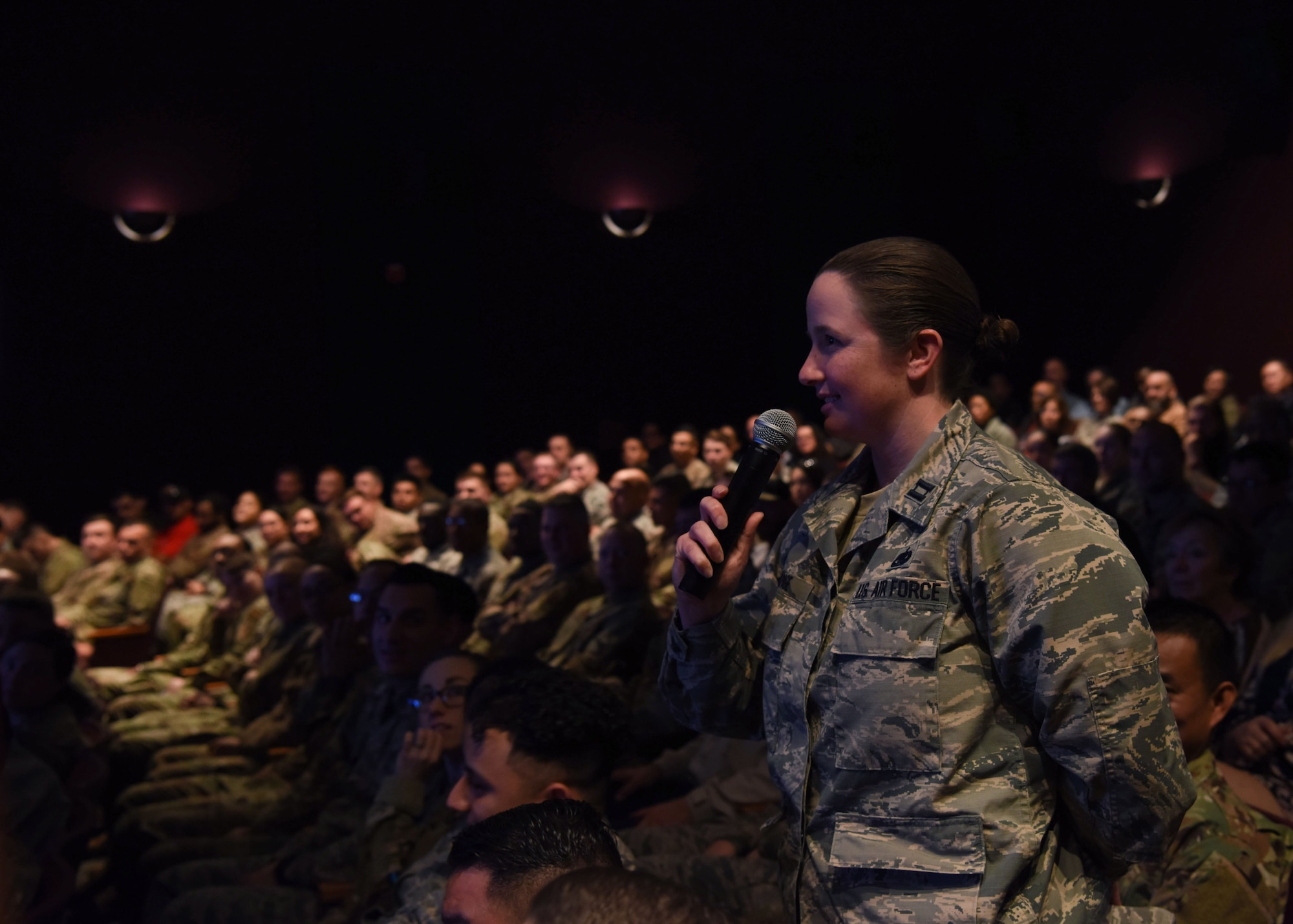 Capt. Bonnie Jo Lange, 30th Logistic Readiness Squadron operations officer, asks a question during an all call held by Col. Anthony Mastalir, 30th Space Wing commander, and Chief Master Sgt. Daryl Hogan, 30th SW command chief, Feb. 27, 2020, at Vandenberg Air Force Base, Calif. Mastalir and Hogan emphasized, that while VAFB is now supporting the U.S. Space Force, the 30th SW’s mission to assure access to space will not change. (U.S. Air Force photo by Senior Airman Aubree Milks)