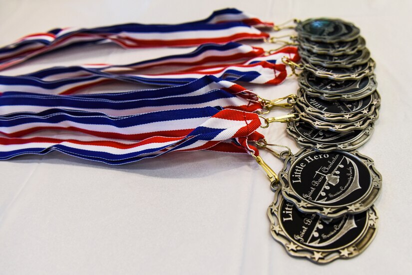 Medals are displayed on a table prior to the Airman and Family Readiness Center’s “Little Heroes” ceremony at Joint Base Charleston, S.C., Feb. 27, 2020.