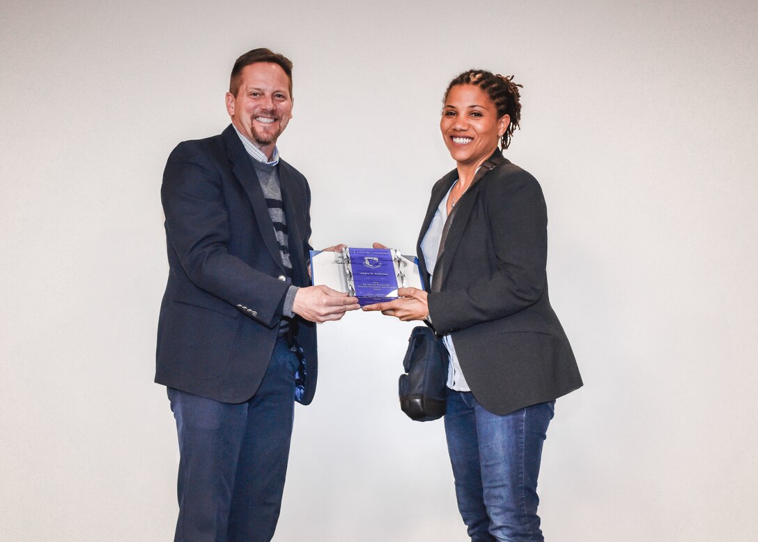 Woman receives award.