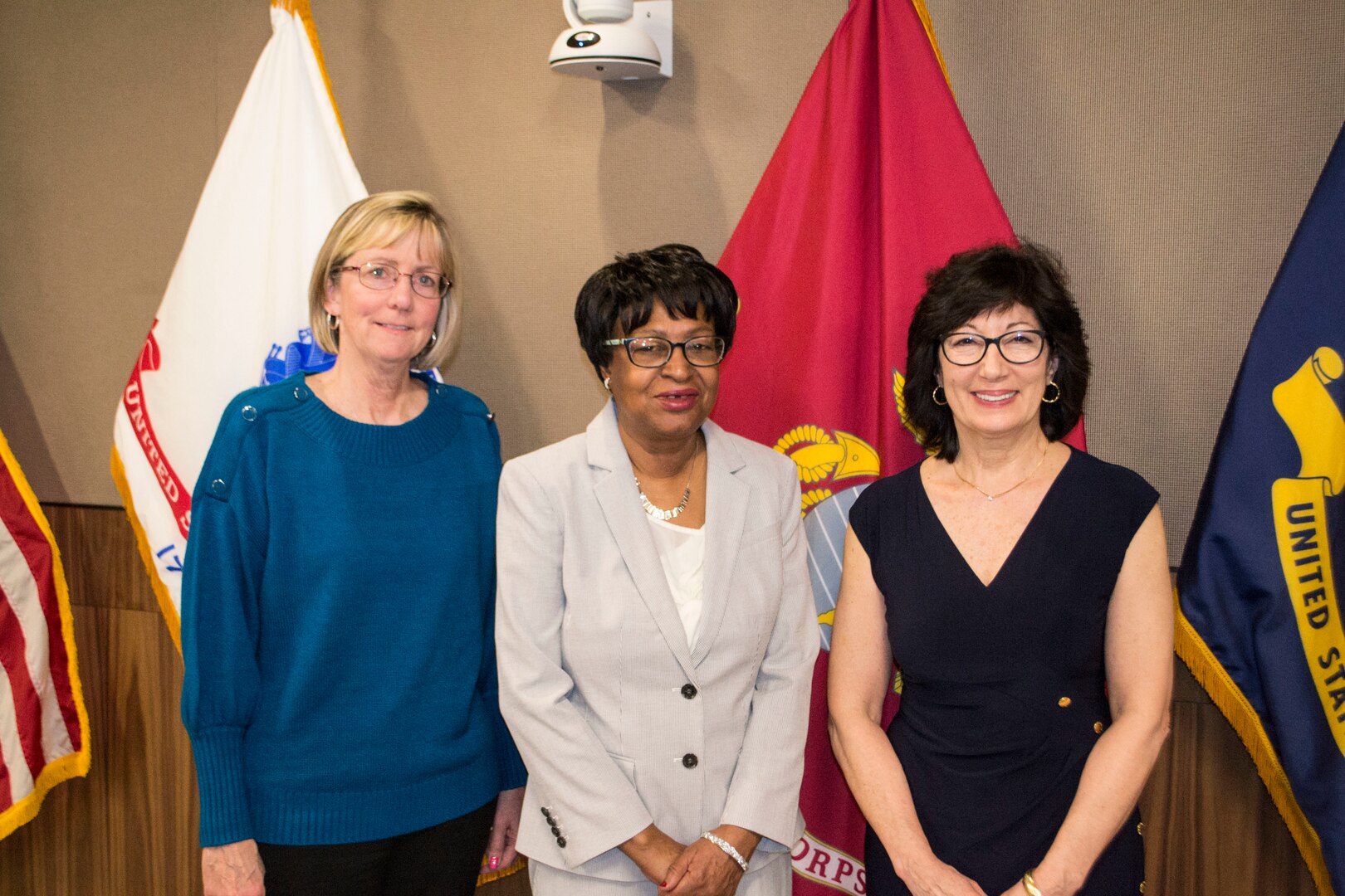 Three female adults who have recently retired from the Defense Logistics Agency Troop Support in Philadelphia are pictured.