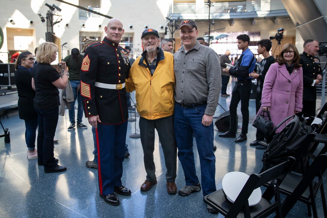 The Sergeant Major of the Marine Corps, Troy E. Black, poses for a photo with Jack Spahr, retired Navy Petty Officer 3rd Class, an Iwo Jima veteran at The President’s Own brass ensemble performance in observance of the 75th anniversary of the battle of Iwo Jima at the National Museum of the Marine Corps in Quantico, V.A., Feb. 23, 2020. The concert was dedicated to Marines and sailors who fought in the battle of Iwo Jima and also thanked veterans who have fought in wars over the last century.