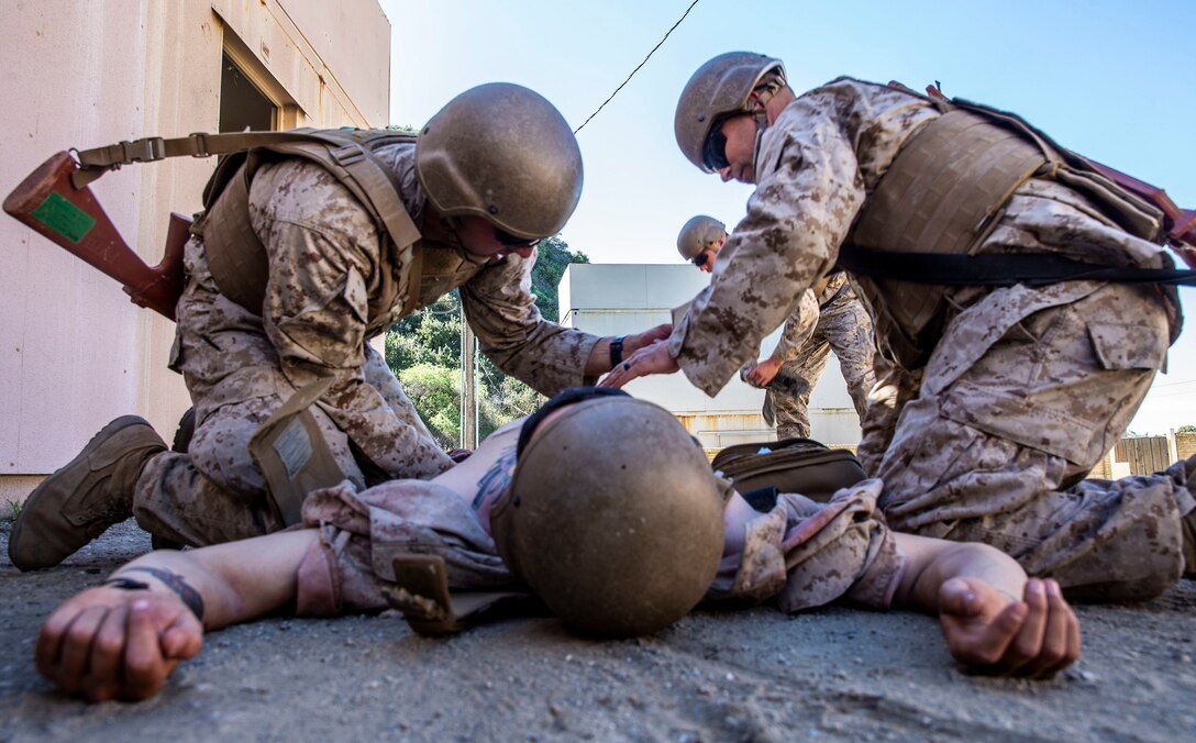 U.S. Navy Chief Petty Officer Aaron McGowan, a student with Field Medical Training Battalion - West, assesses a simulated casualty during casualty assessment drills at FMTB training site on Marine Corps Base Camp Pendleton, California, Feb. 19, 2020. This training gives students practice in handling casualties in the field. The staff and instructors at FMTB-West are responsible for training the corpsmen and officers who provide medical support to the Fleet Marine Force. McGowan is a native of St. Louis. (U.S. Marine Corps photo by Lance Cpl. Alison Dostie)