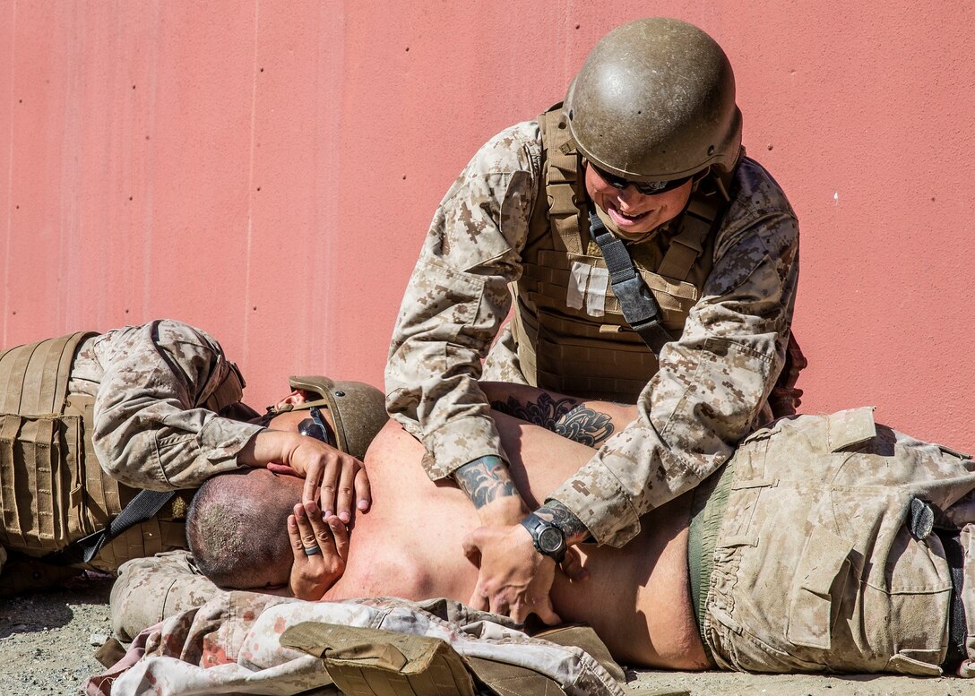 U.S. Navy Petty Officer 1st Class Ryan Leonard, a student with Field Medical Training Battalion - West, log rolls a simulated casualty during casualty assessment drills at the FMTB training site on Marine Corps Base Camp Pendleton, California, Feb. 19, 2020. This training gives students practice in handling casualties in the field. The staff and instructors at FMTB-West are responsible for training the corpsmen and officers who provide medical support to the Fleet Marine Force. Leonard is a native of Middletown, New Jersey. (U.S. Marine Corps photo by Lance Cpl. Alison Dostie)